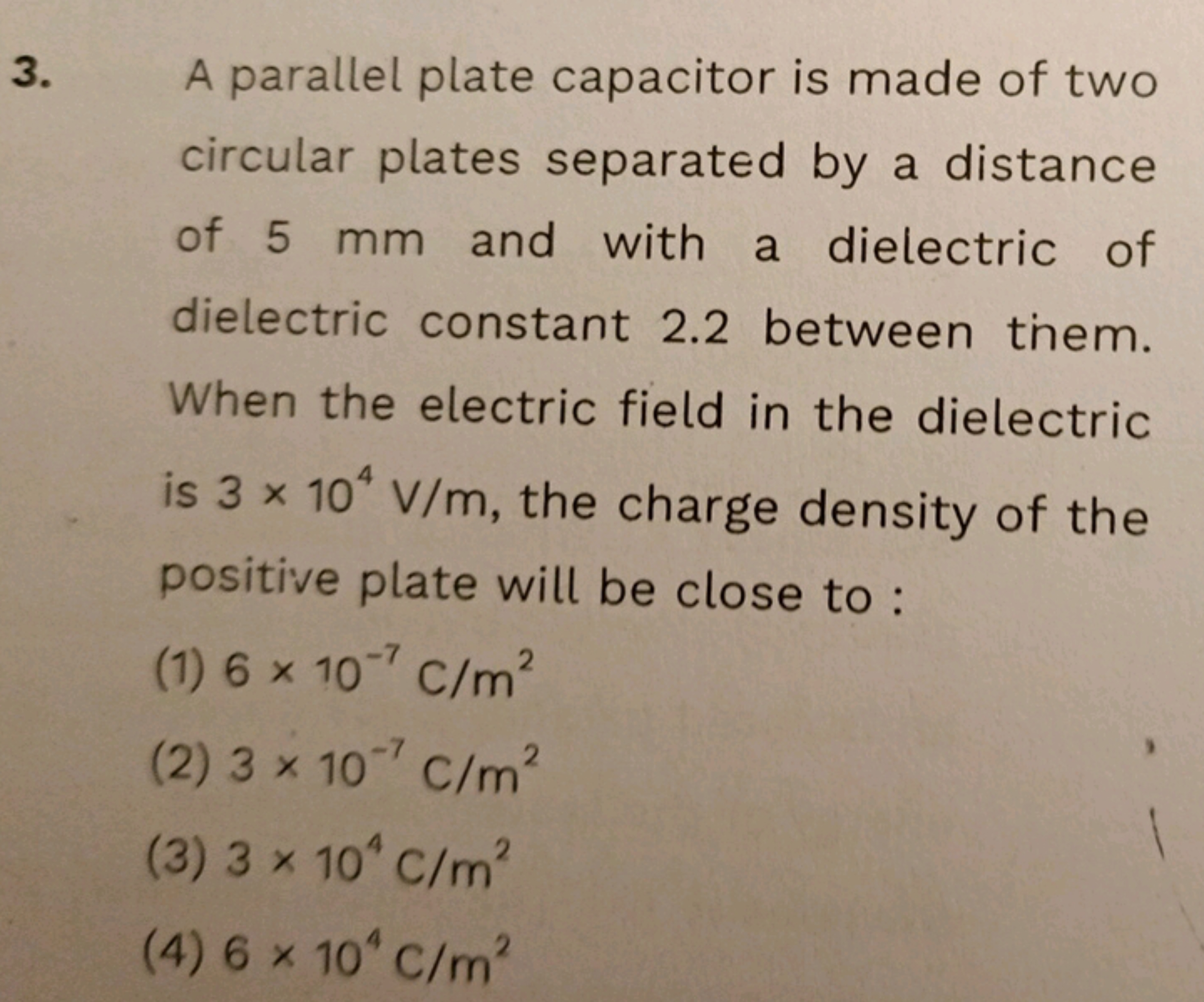 3. A parallel plate capacitor is made of two circular plates separated