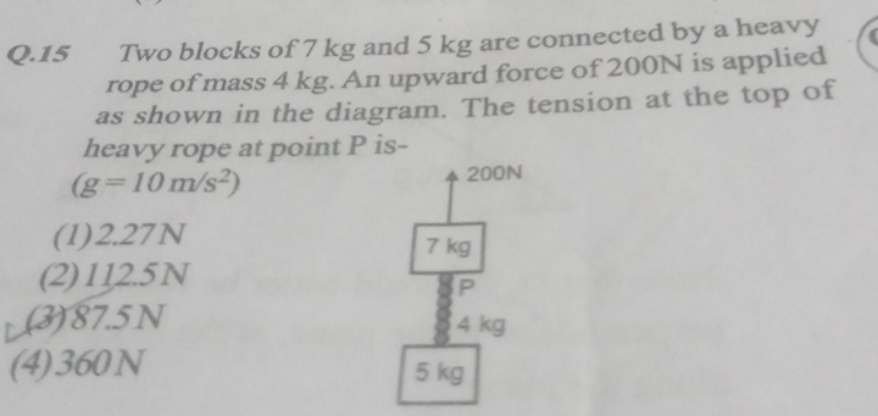 Q. 15 Two blocks of 7 kg and 5 kg are connected by a heavy rope of mas