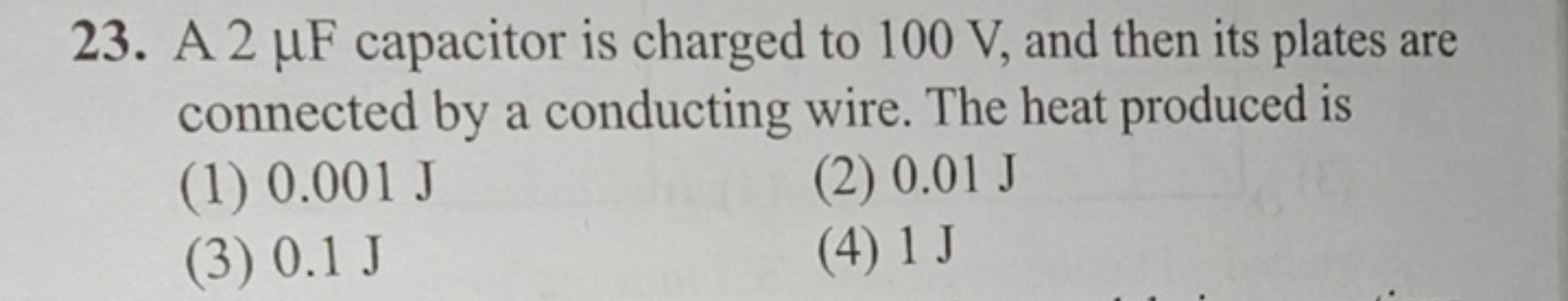 23. A 2μF capacitor is charged to 100 V , and then its plates are conn