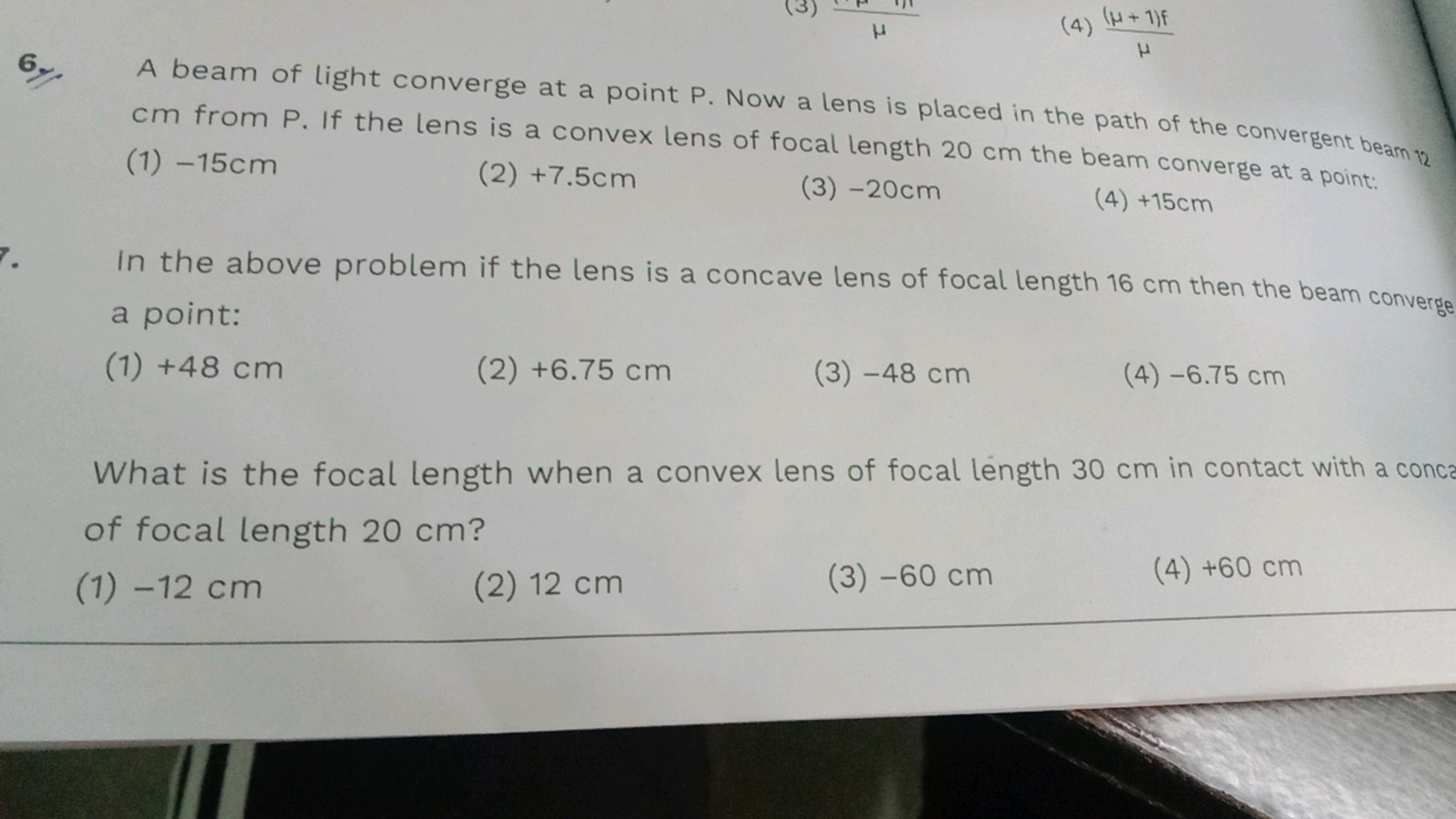 6. A beam of light converge at a point P. Now a lens is placed in the 