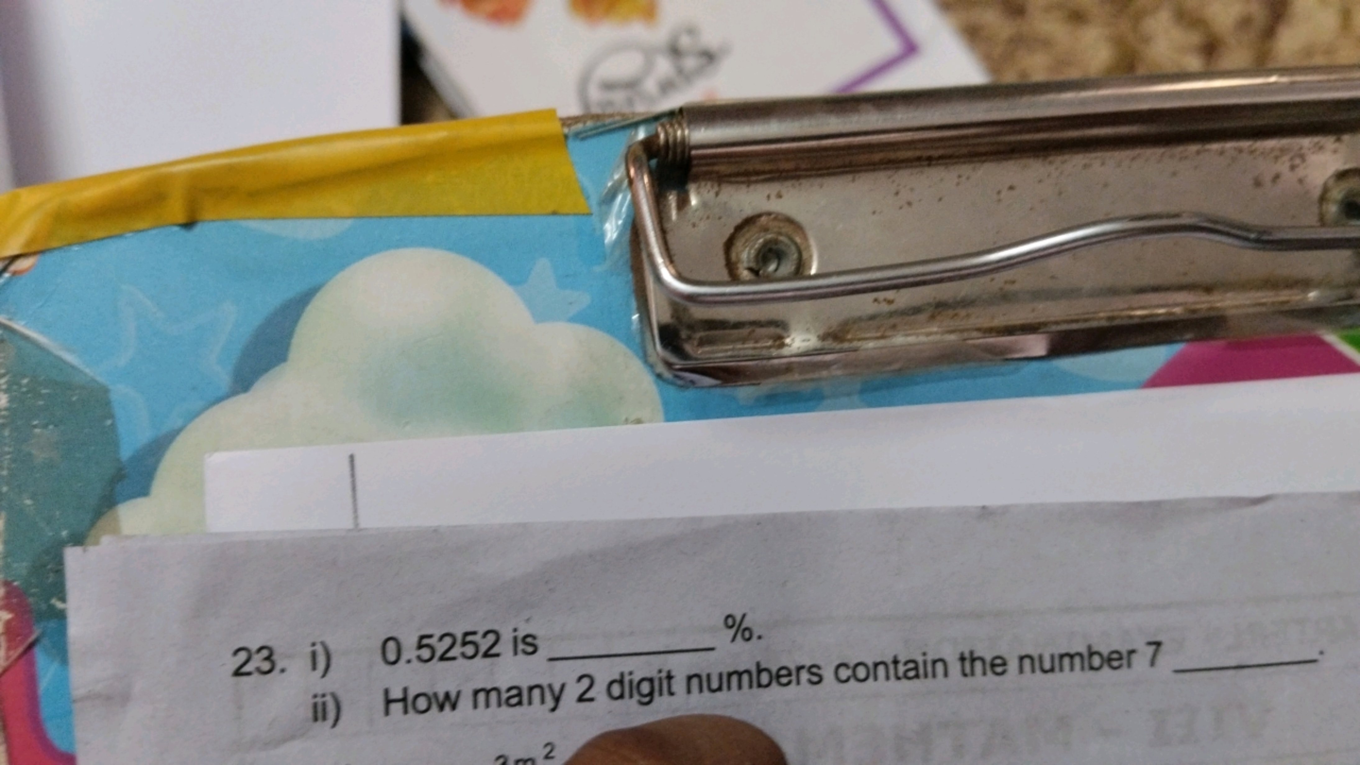 23. i) 0.5252 is  %.
ii) How many 2 digit numbers contain the number 7