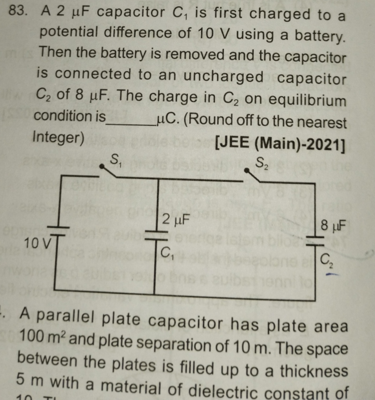 83. A 2μF capacitor C1​ is first charged to a potential difference of 