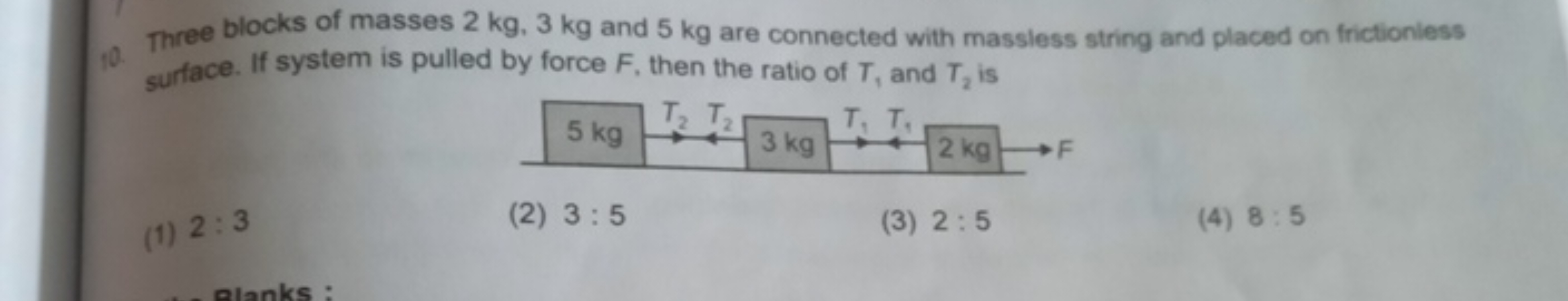 10. Three blocks of masses 2 kg .3 kg and 5 kg are connected with mass