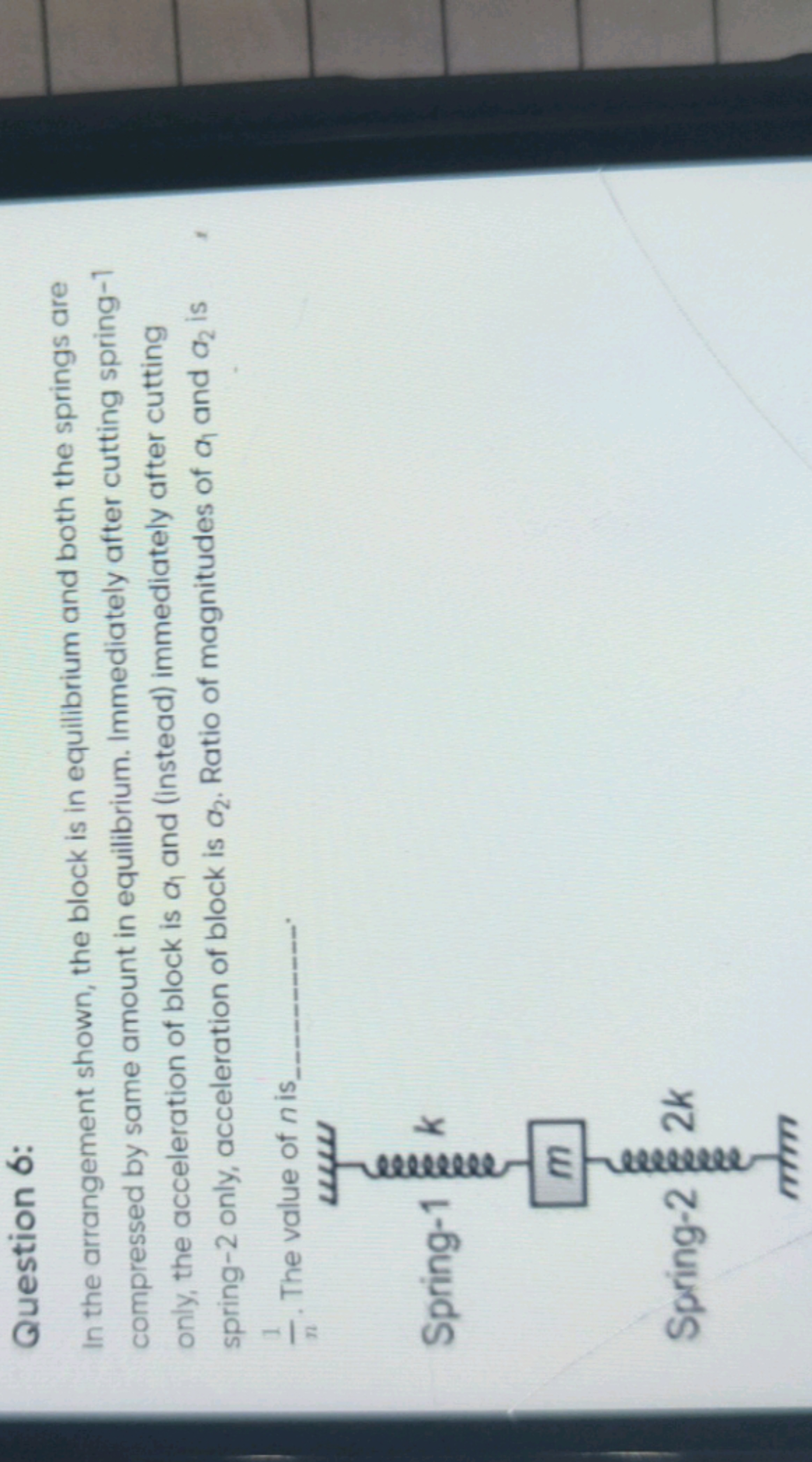 Question 6:
In the arrangement shown, the block is in equilibrium and 