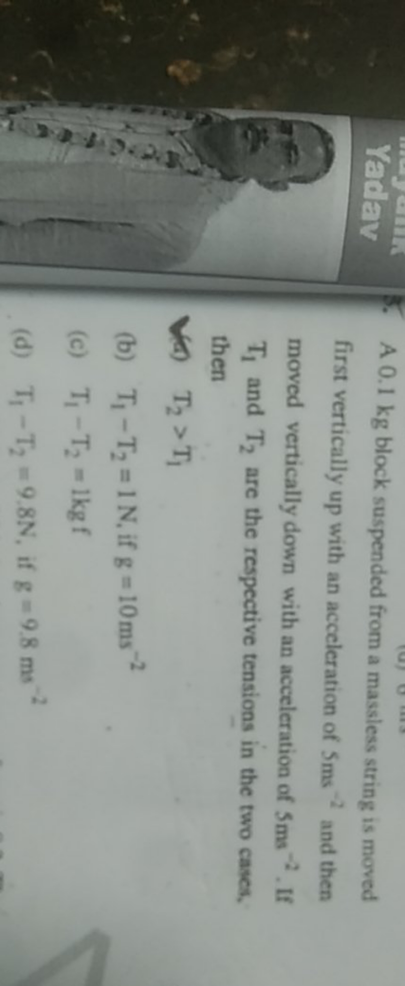 Yaday
5. A 0.1 kg block suspended from a massless string is moved firs