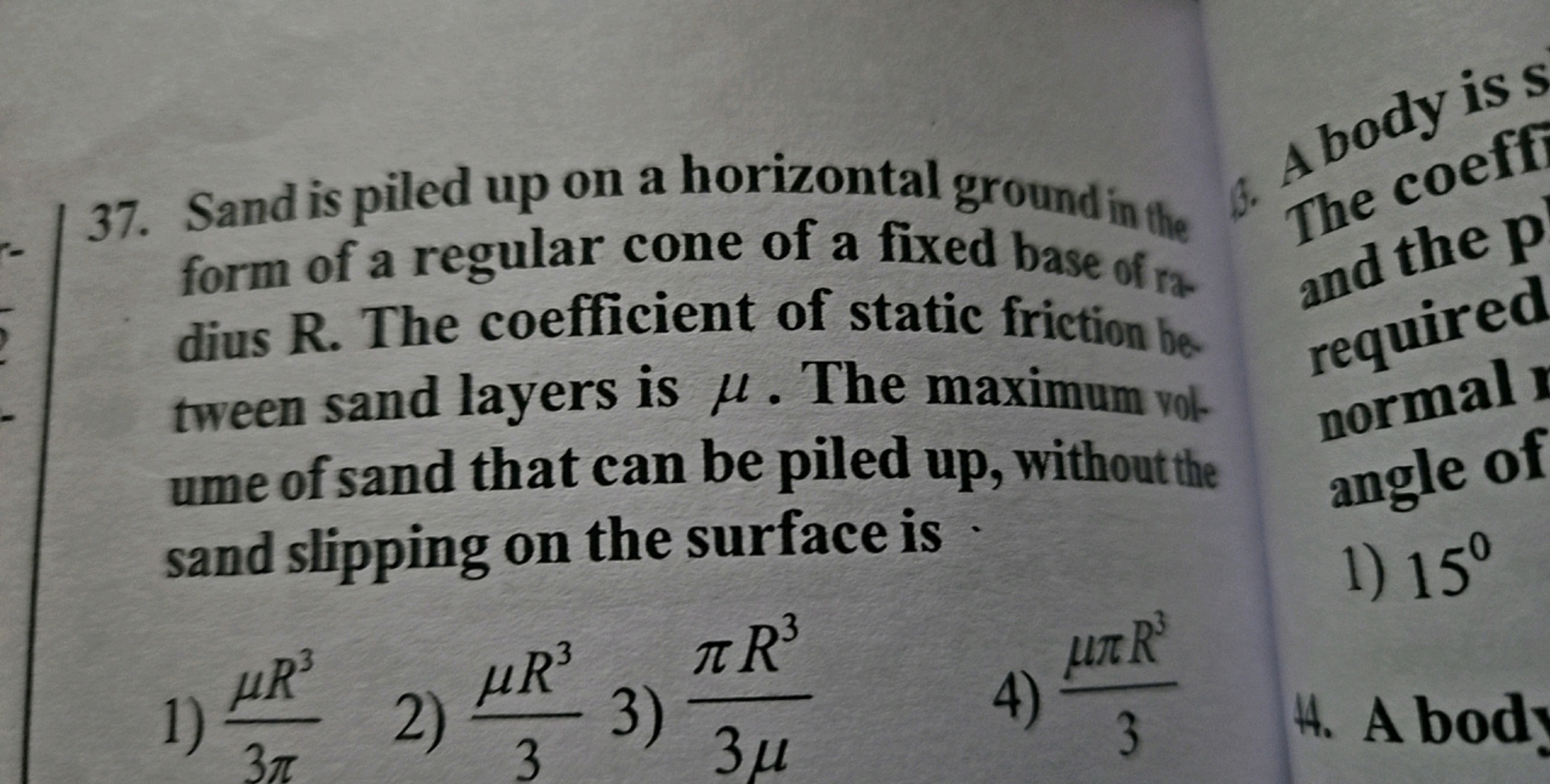 37. Sand is piled up on a horizontal ground in the
form of a regular c