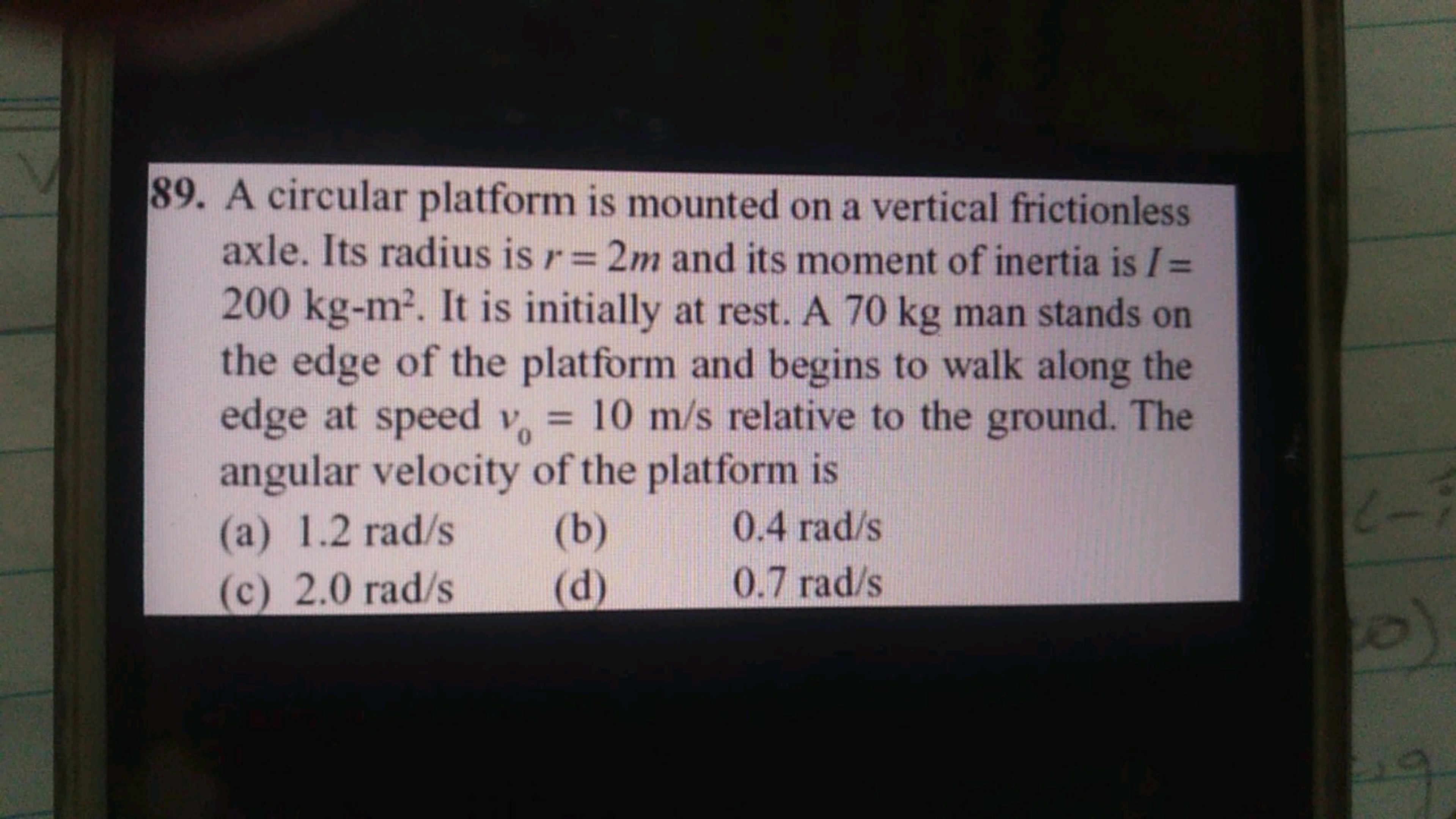 89. A circular platform is mounted on a vertical frictionless axle. It