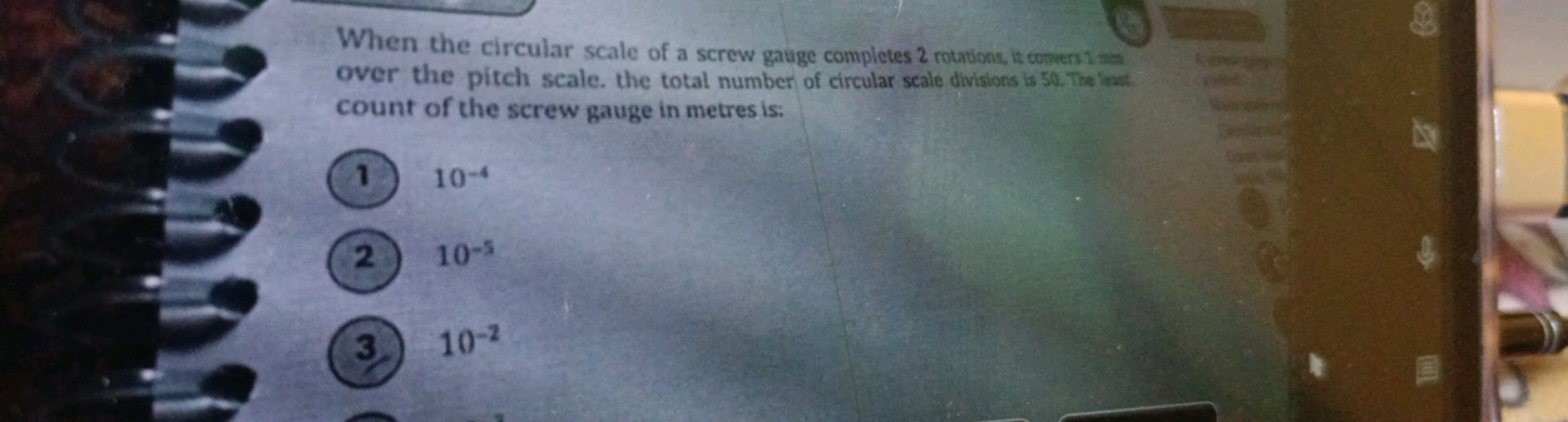 When the circular scale of a screw gauge completes 2 rotations, it con