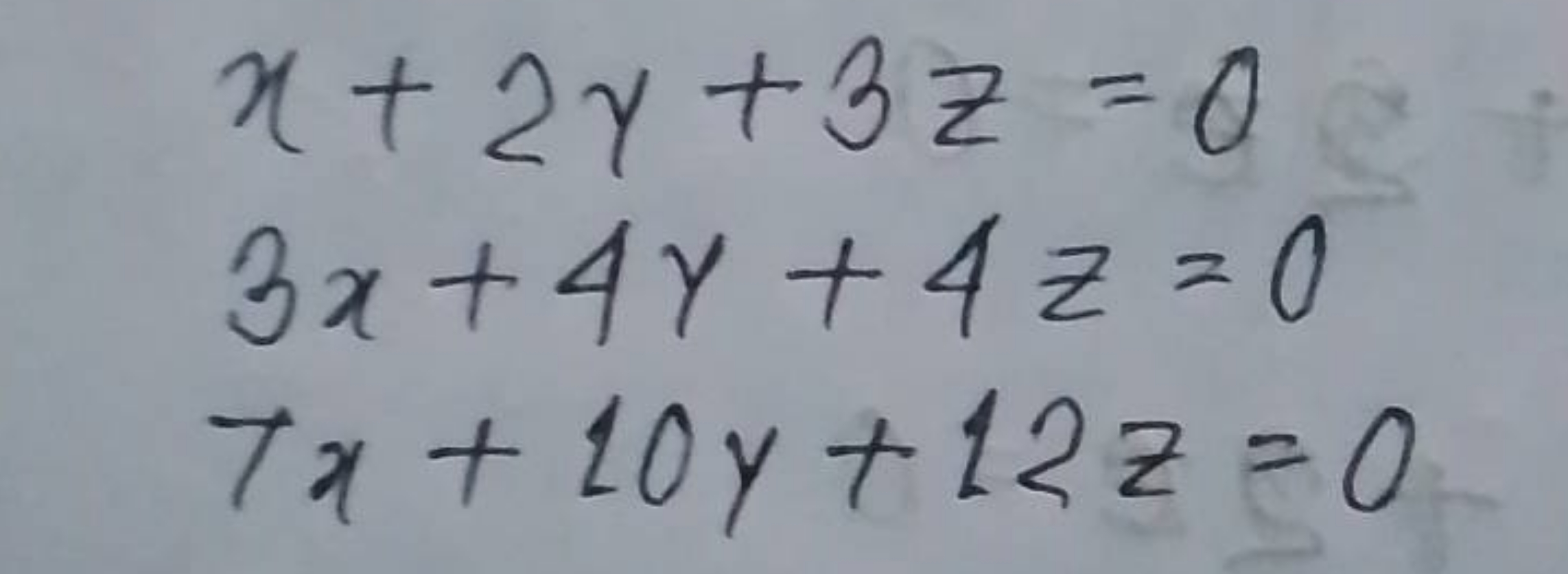 x+2y+3z=03x+4y+4z=07x+10y+12z=0​