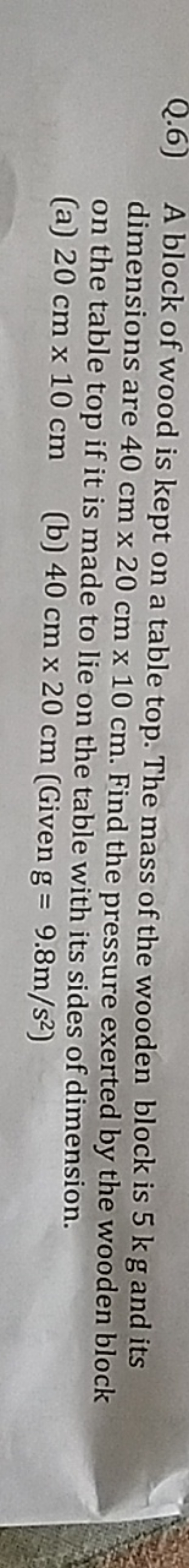 Q.6) A block of wood is kept on a table top. The mass of the wooden bl