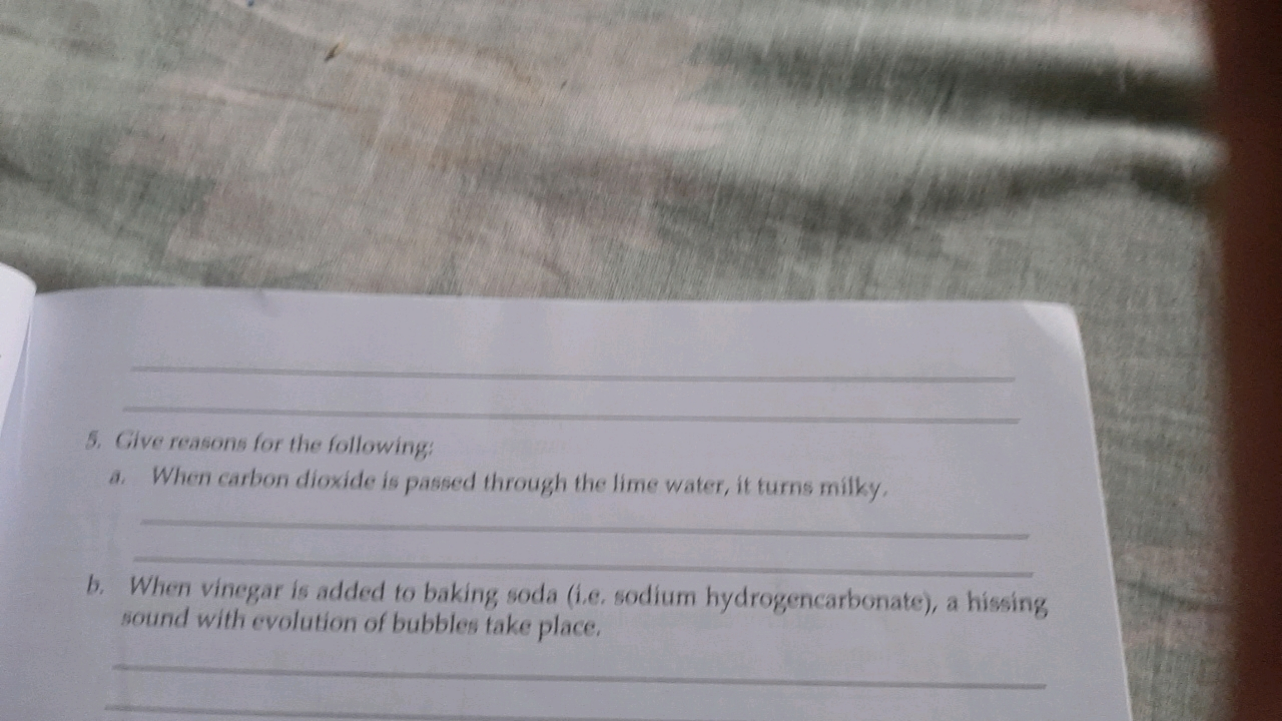 5. Give reasons for the following:
a. When carbon dioxide is passed th