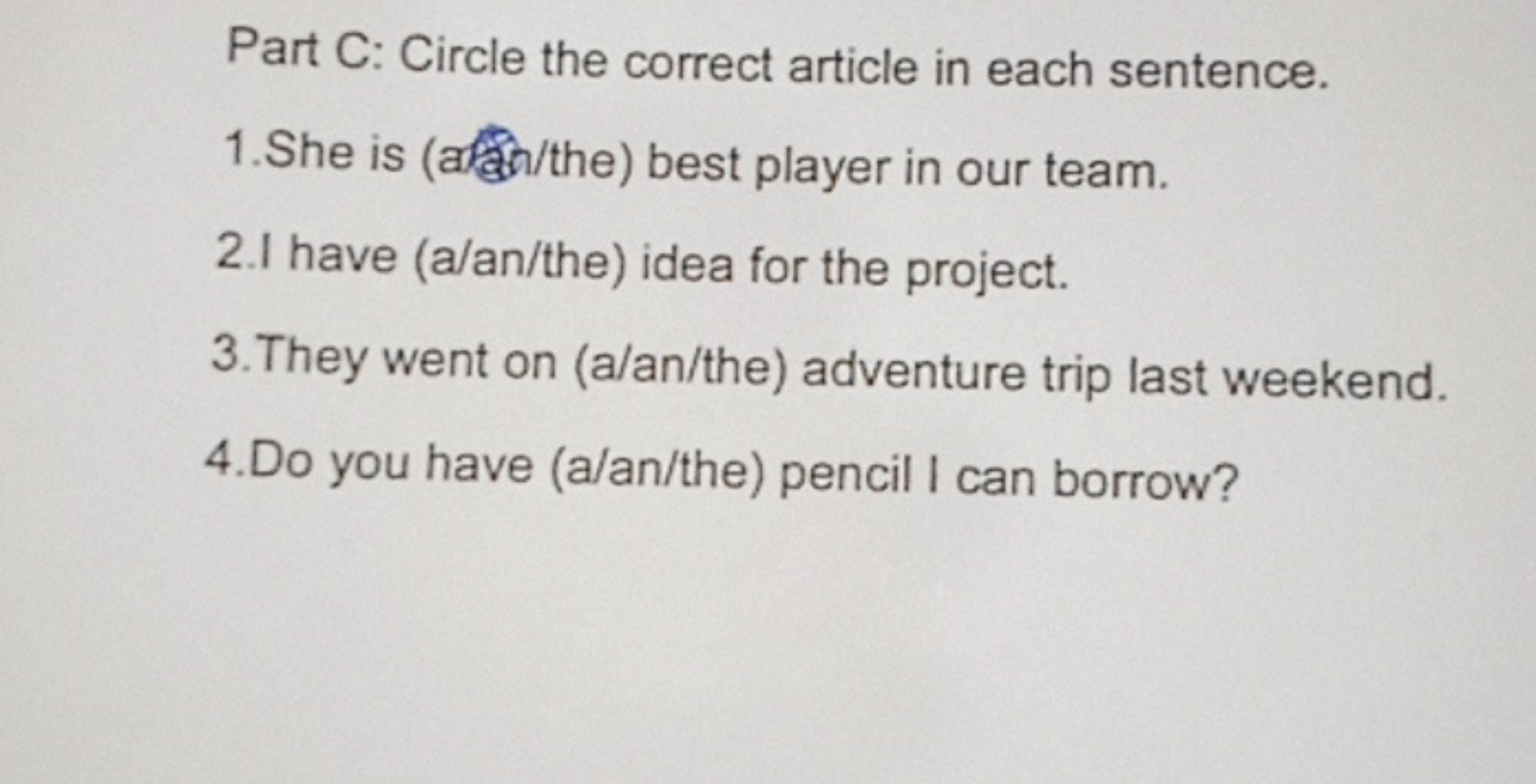 Part C: Circle the correct article in each sentence.
1. She is (atatho