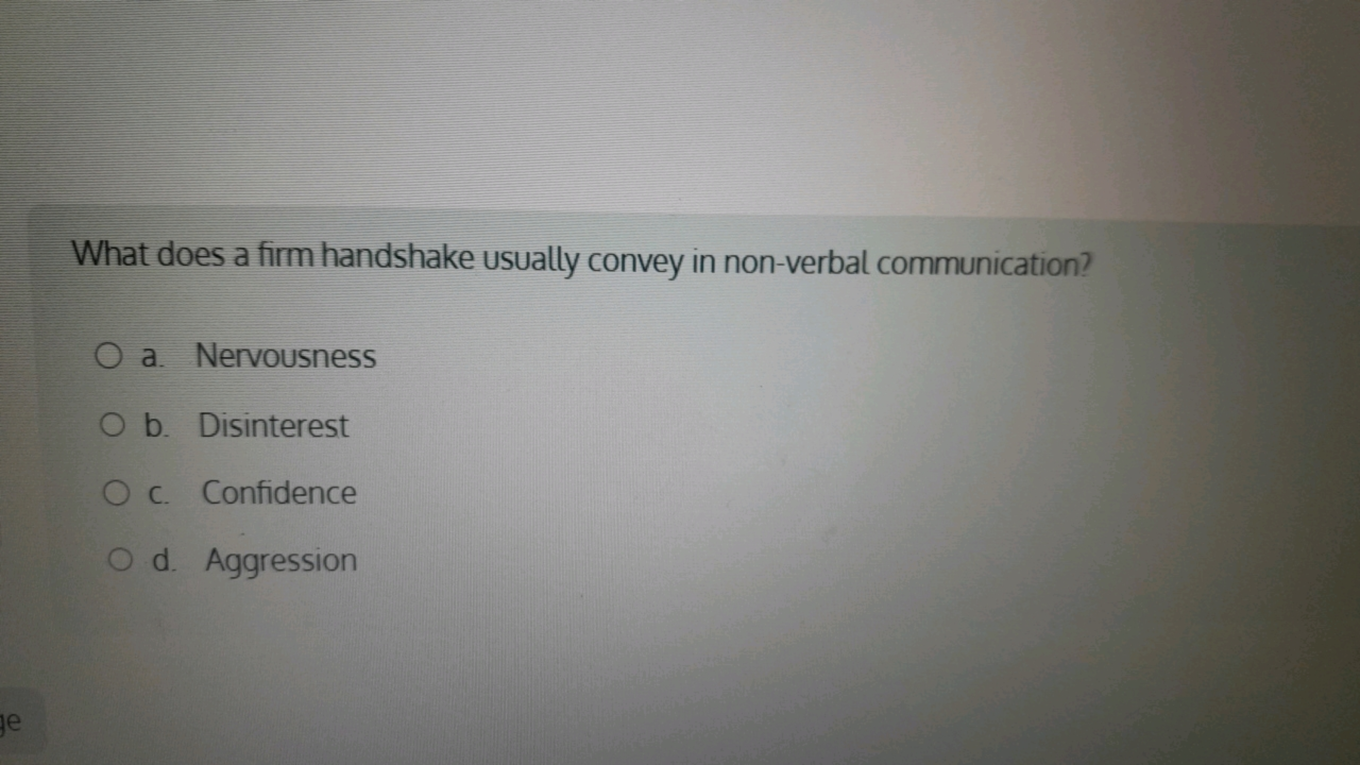 What does a firm handshake usually convey in non-verbal communication?