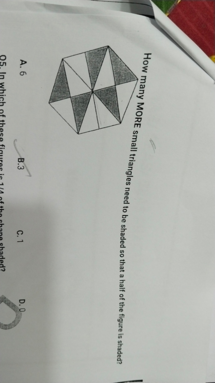 How many MORE small triangles need to be shaded so that a half of the 