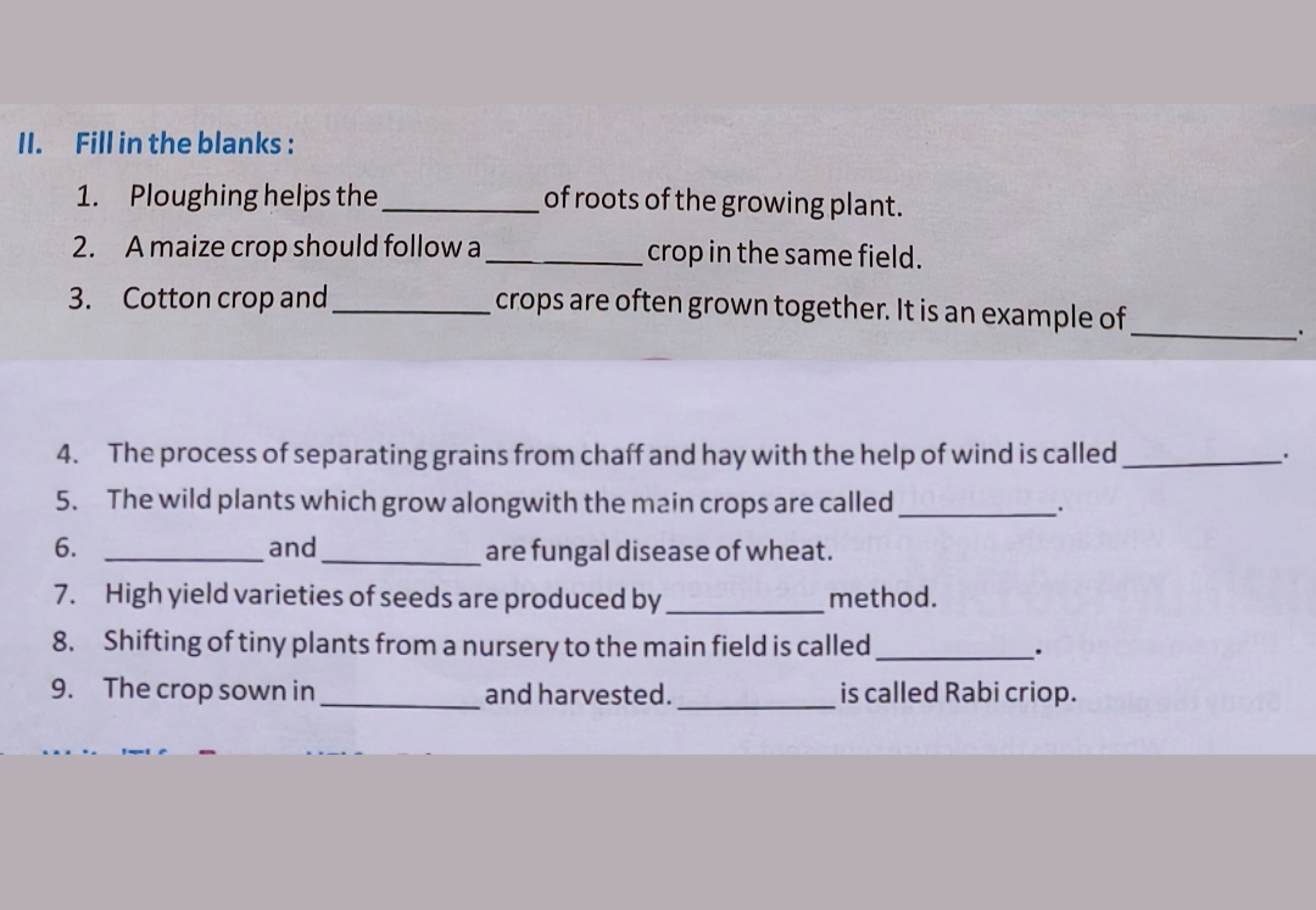 II. Fill in the blanks :
1. Ploughing helps the  of roots of the growi