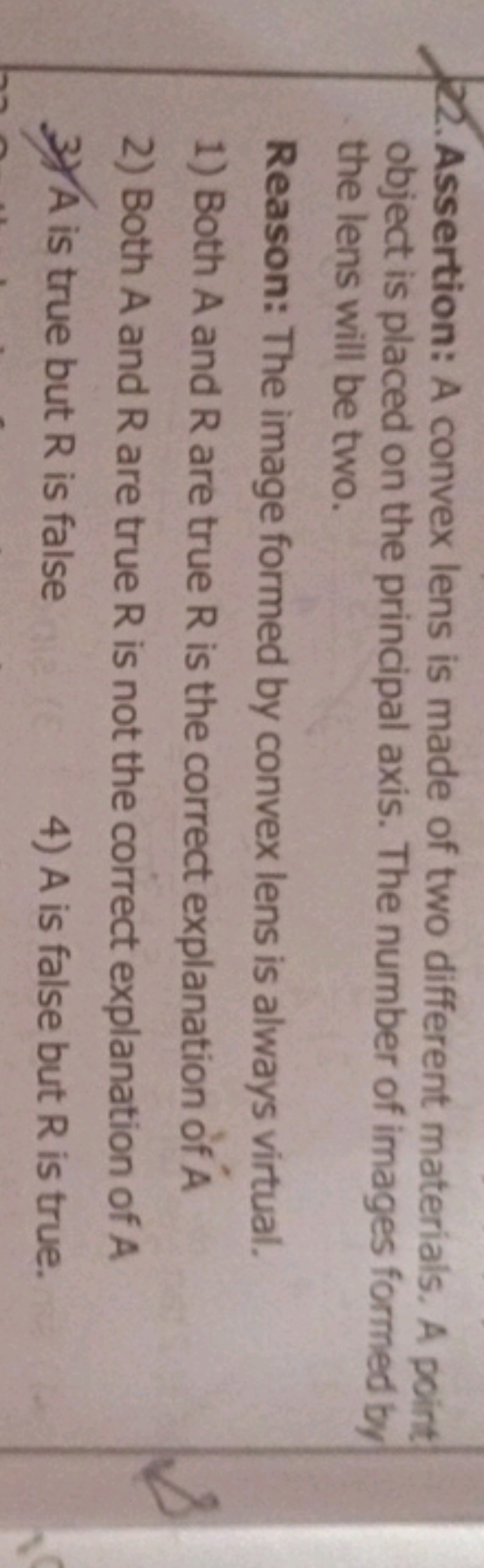 22.Assertion: A convex lens is made of two different materials. A poin