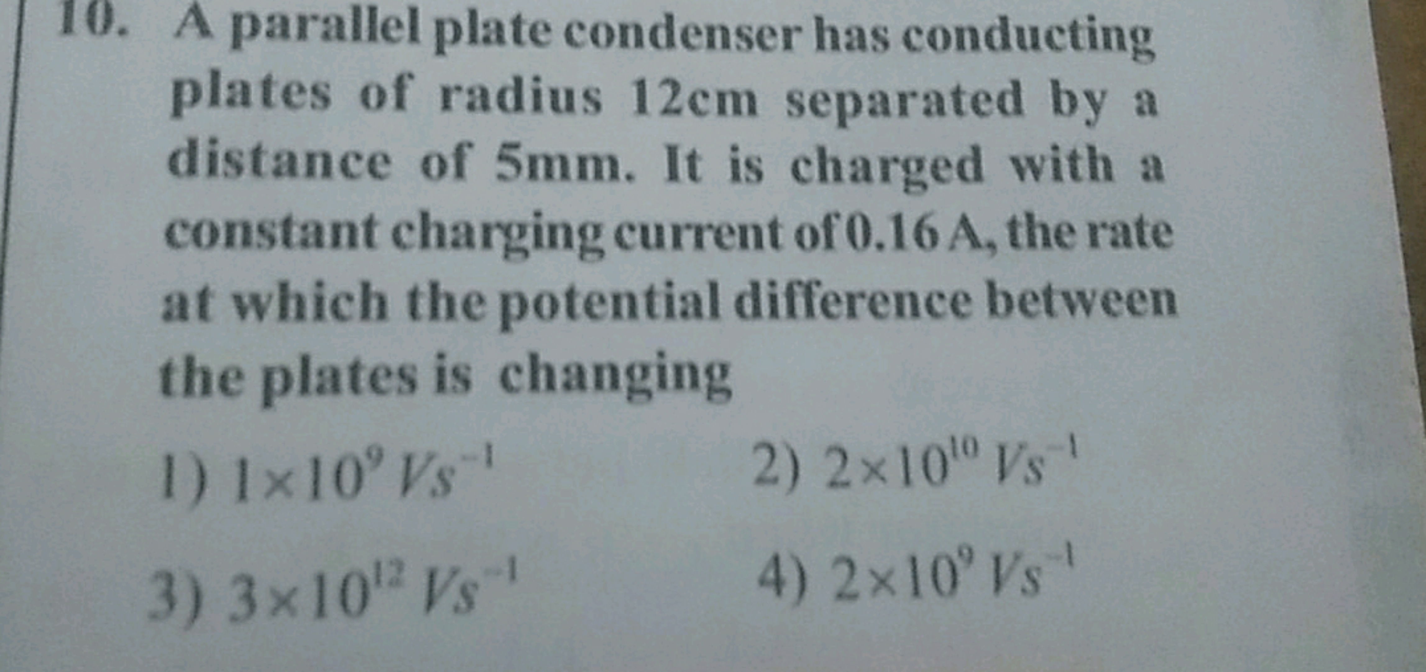 10. A parallel plate condenser has conducting plates of radius 12 cm s