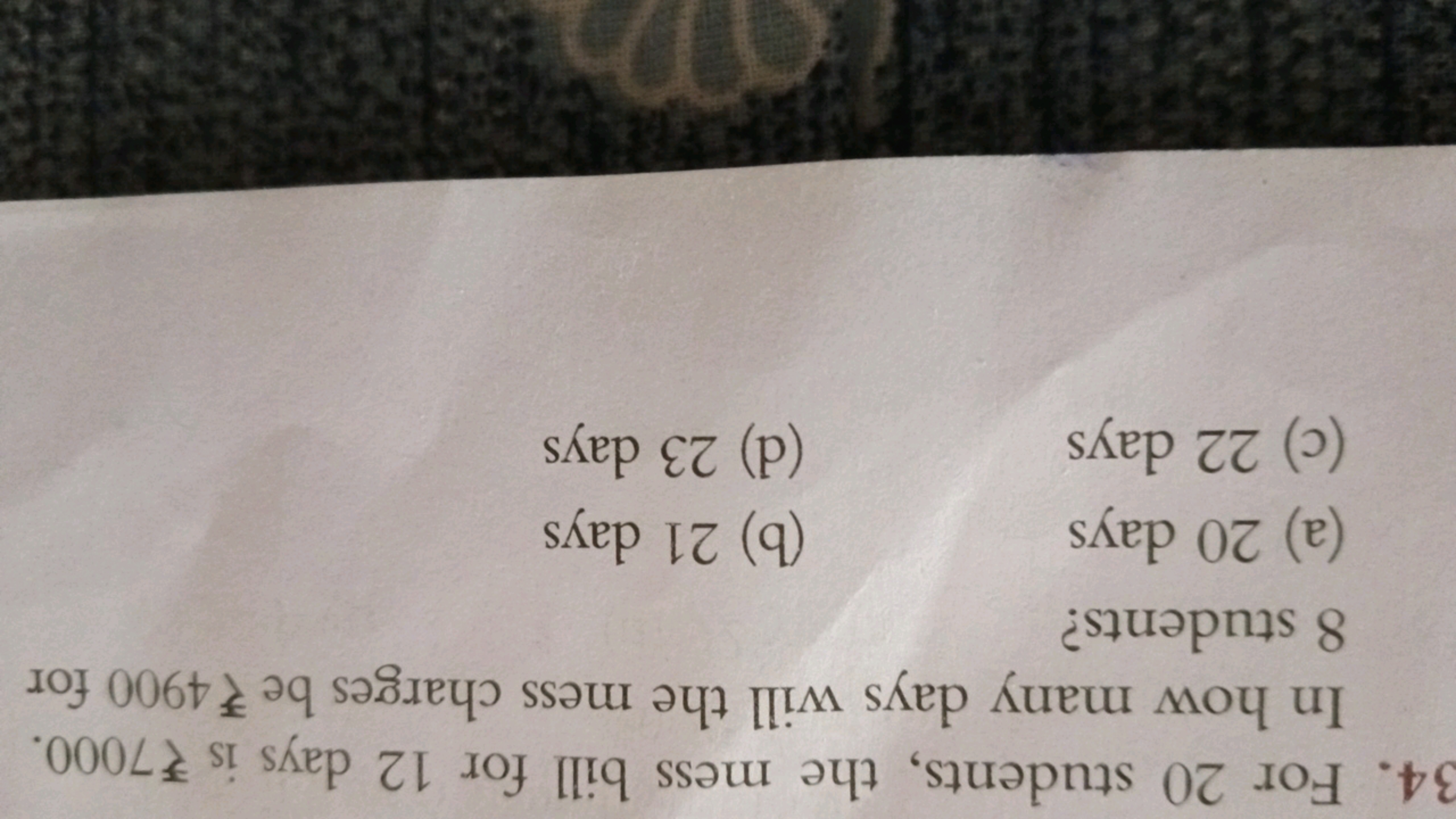 34. For 20 students, the mess bill for 12 days is ₹7000. In how many d