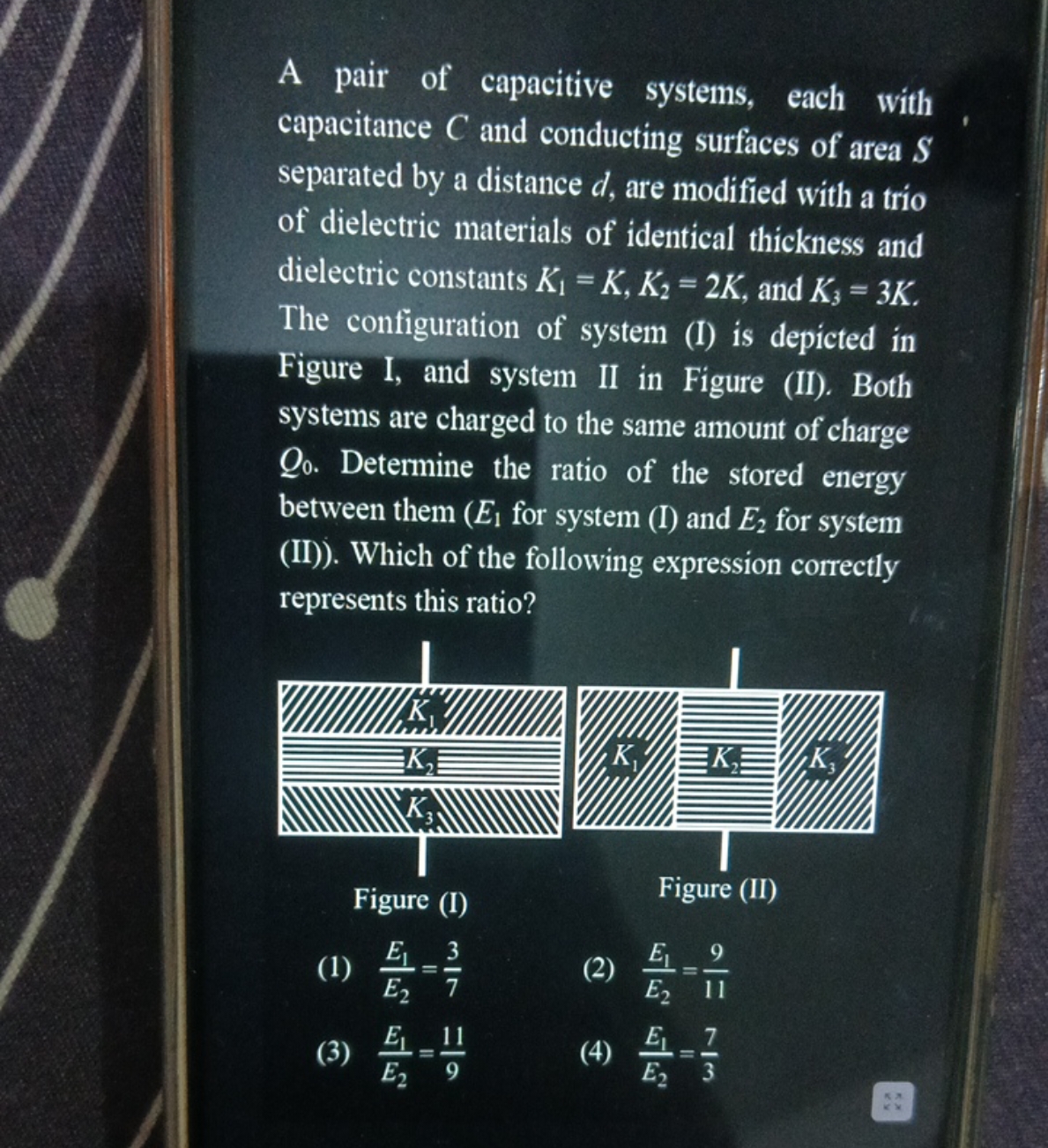 A pair of capacitive systems, each with capacitance C and conducting s