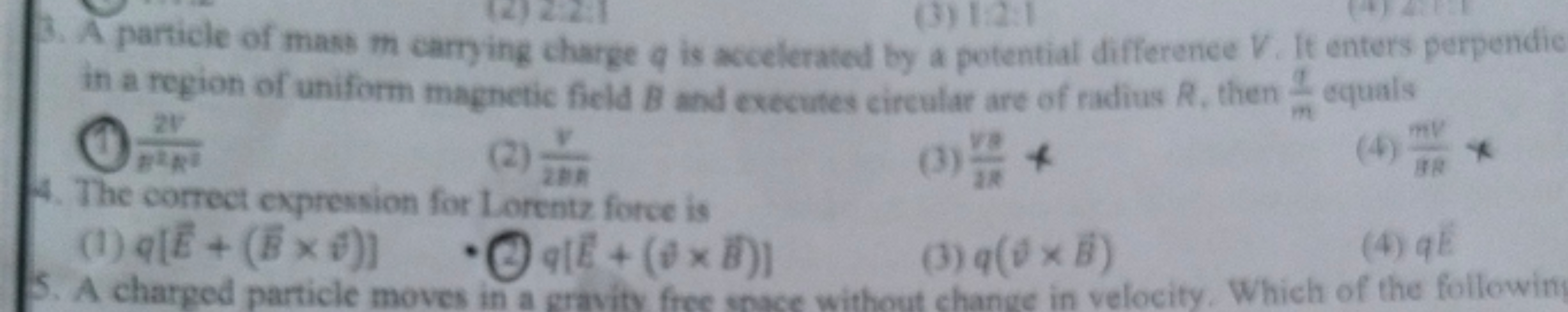 (3) 1:2:1
3. A particle of mass m carrying charge q is accelerated by 