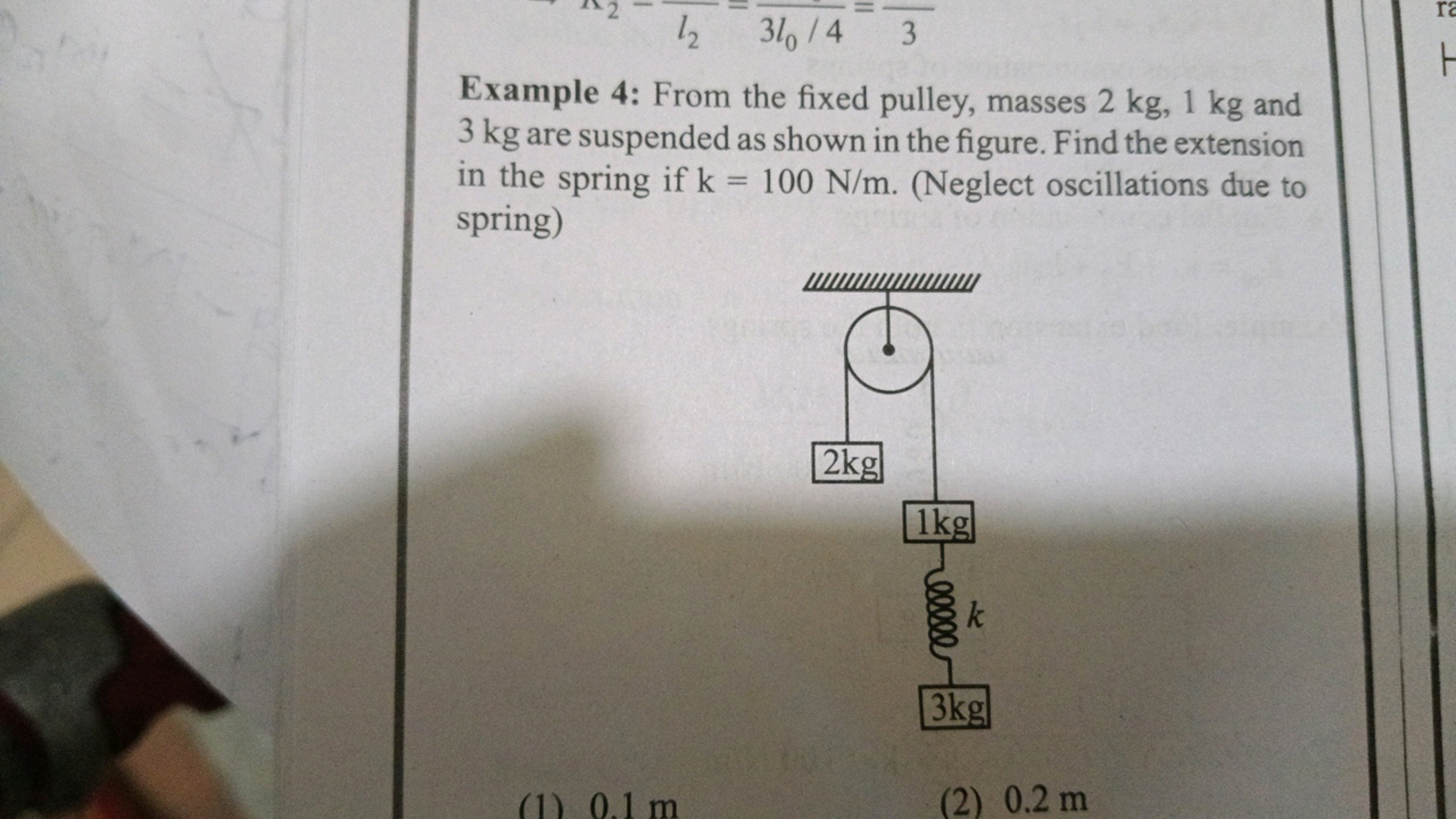 an □l2​​=3l0​/4​=31​
Example 4: From the fixed pulley, masses 2 kg,1 k