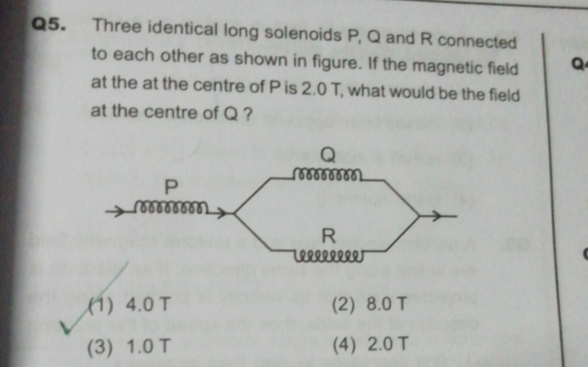 Q5. Three identical long solenoids P, Q and R connected to each other 