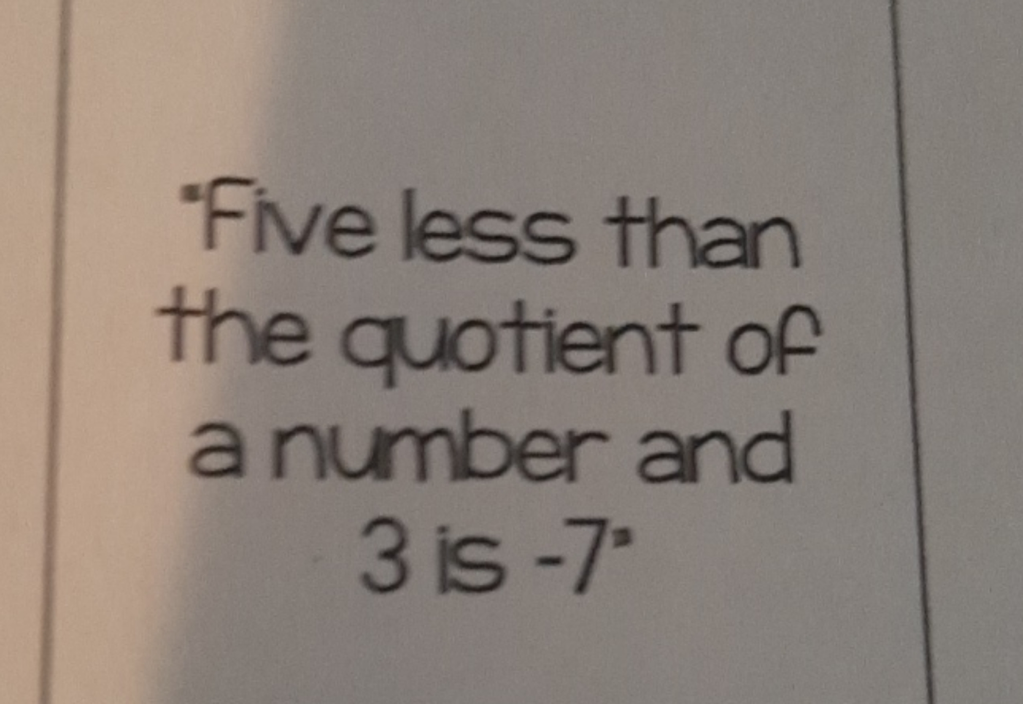 "Five less than the quotient of a number and 3 is −7∘