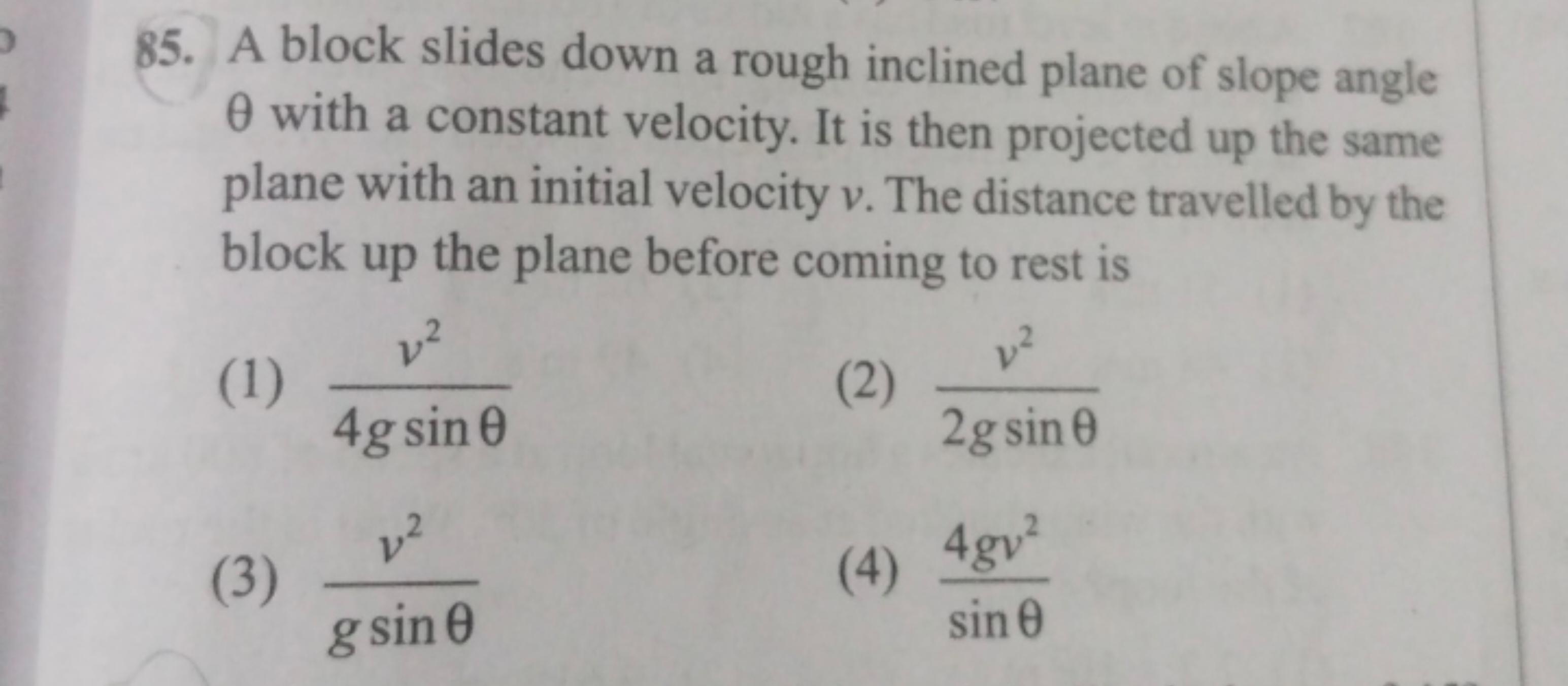 85. A block slides down a rough inclined plane of slope angle θ with a