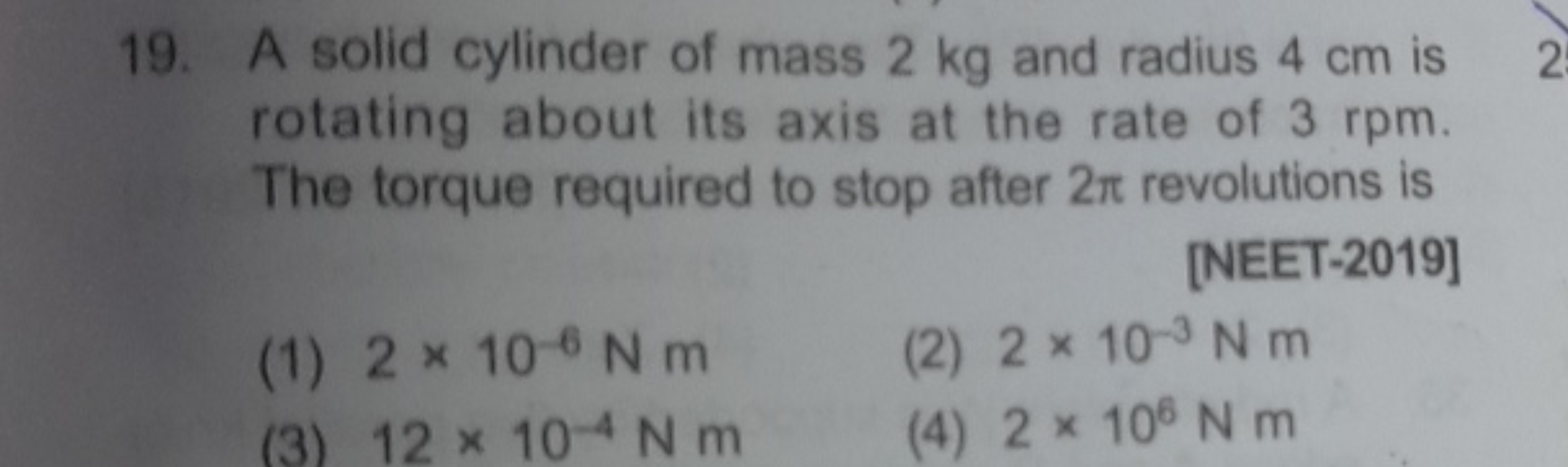 19. A solid cylinder of mass 2 kg and radius 4 cm is rotating about it