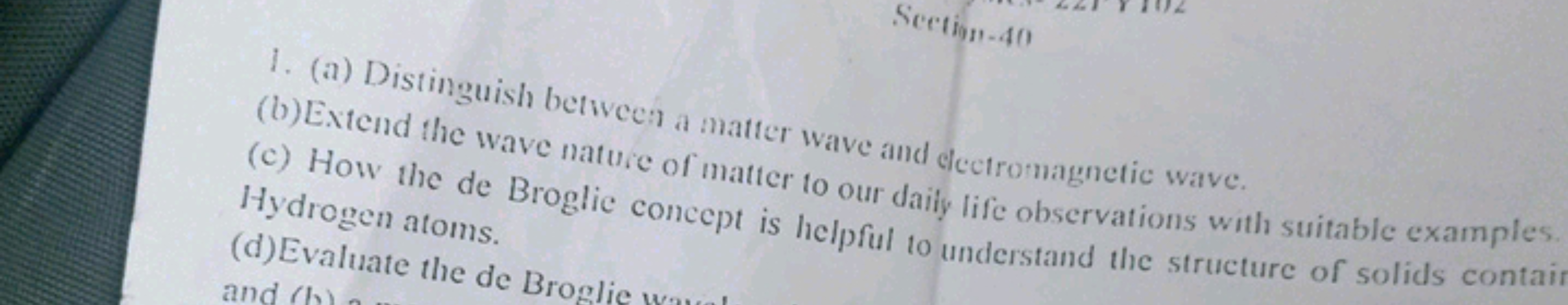 1. (a) Distinguish between a matter wave and electromagnetic wave.
(b)