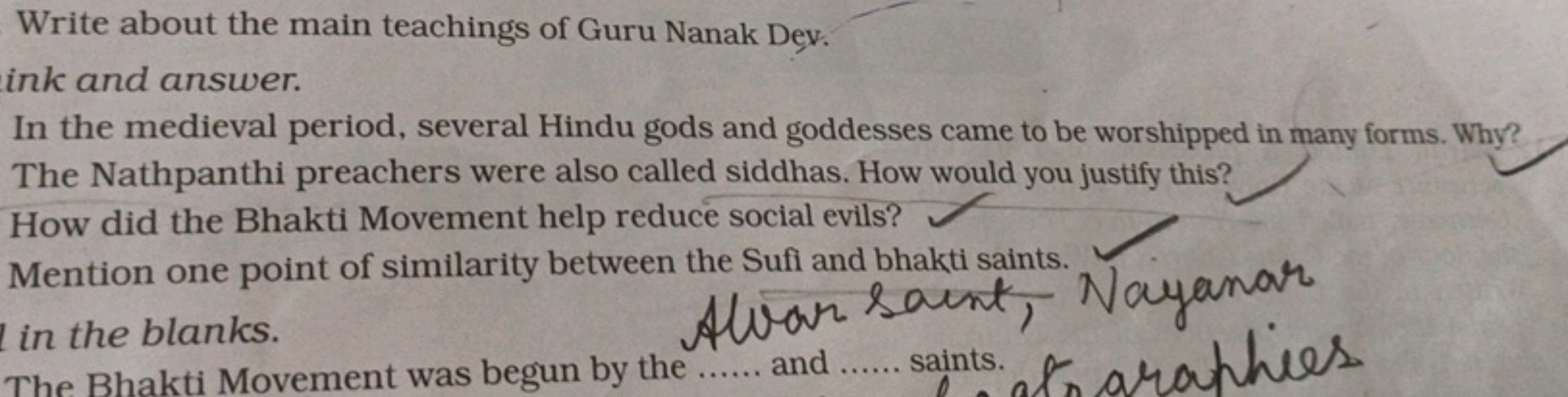 Write about the main teachings of Guru Nanak Dev.
ink and answer.
In t