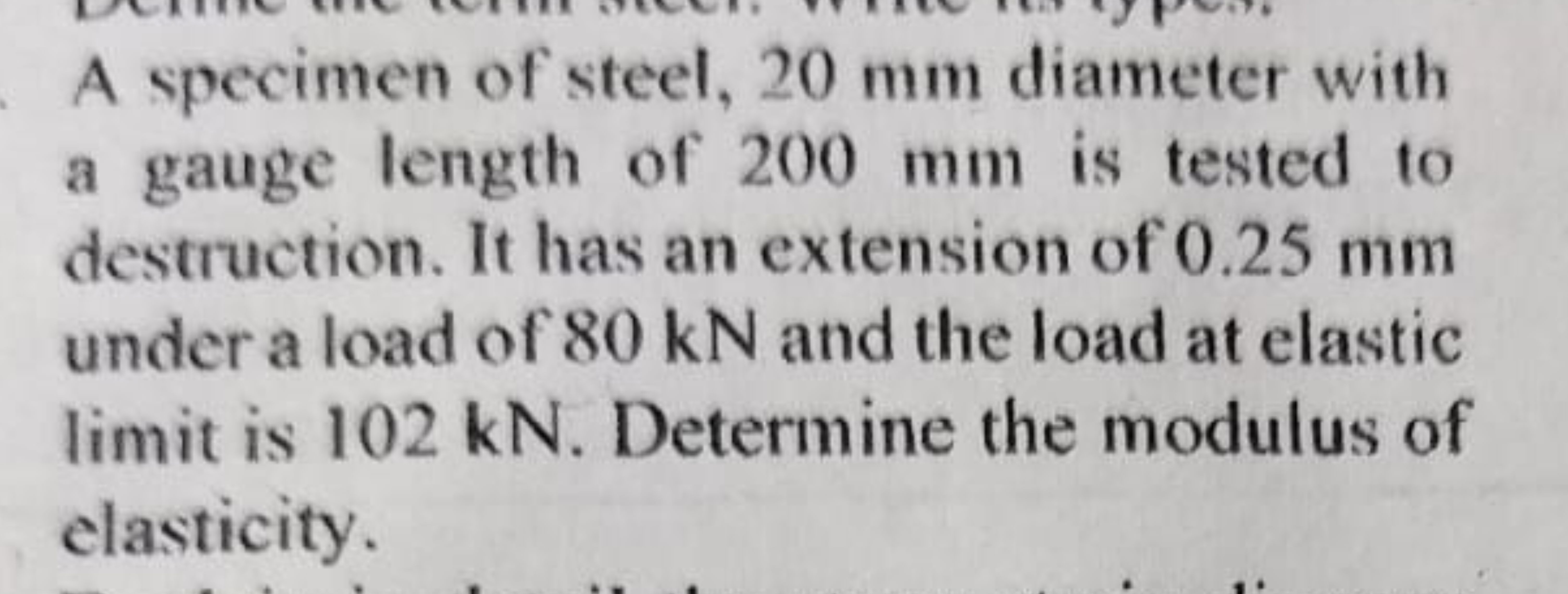 A specimen of steel, 20 mm diameter with a gauge length of 200 mm is t