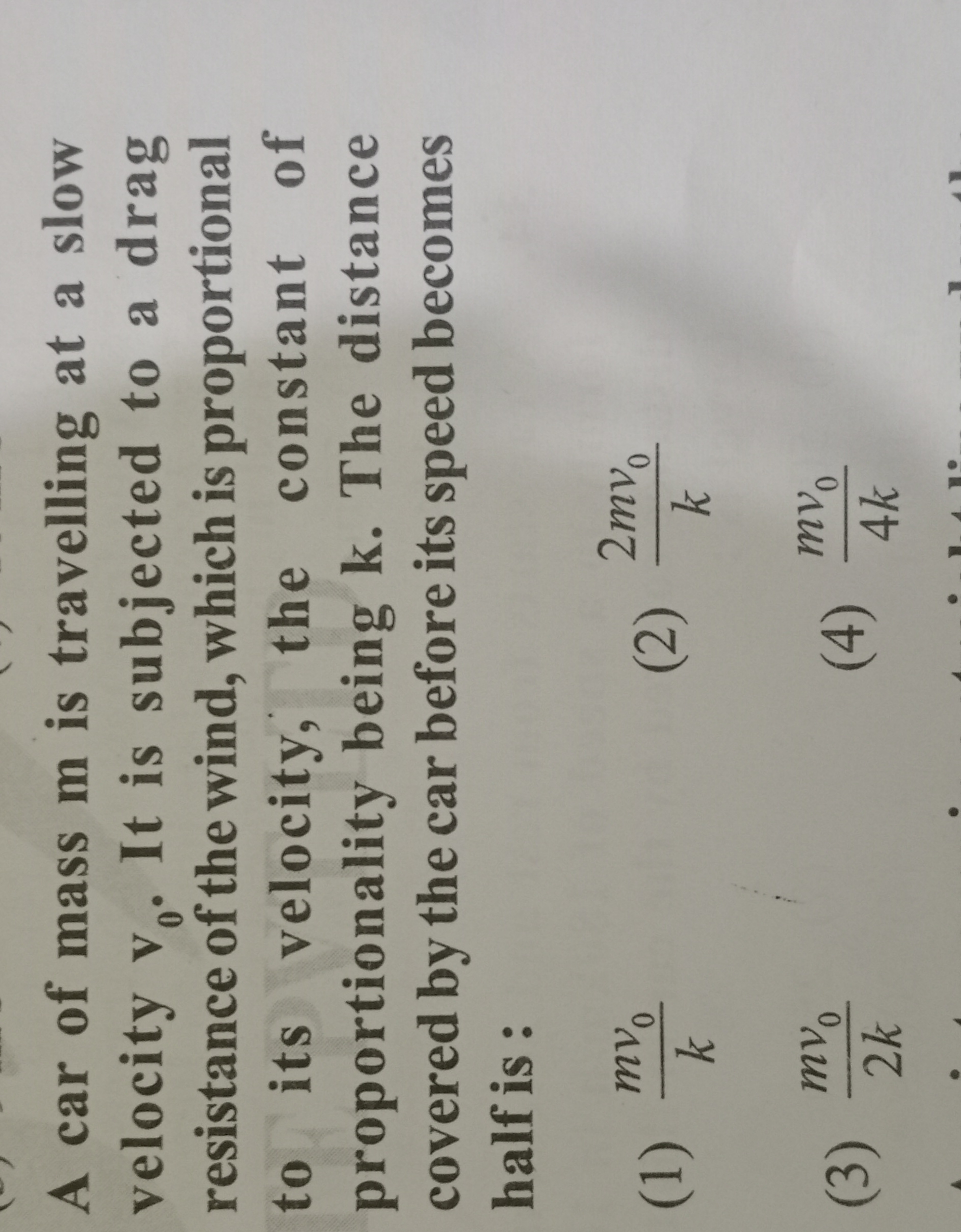 A car of mass m is travelling at a slow velocity v0​. It is subjected 