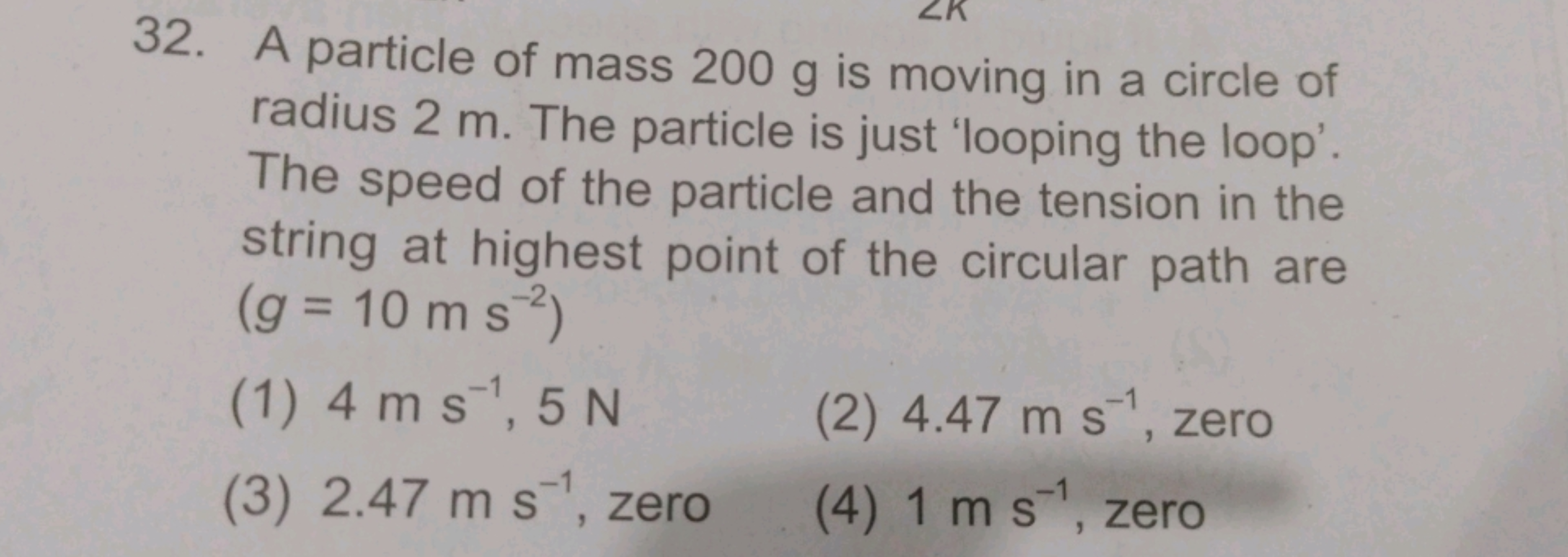 32. A particle of mass 200 g is moving in a circle of radius 2 m . The