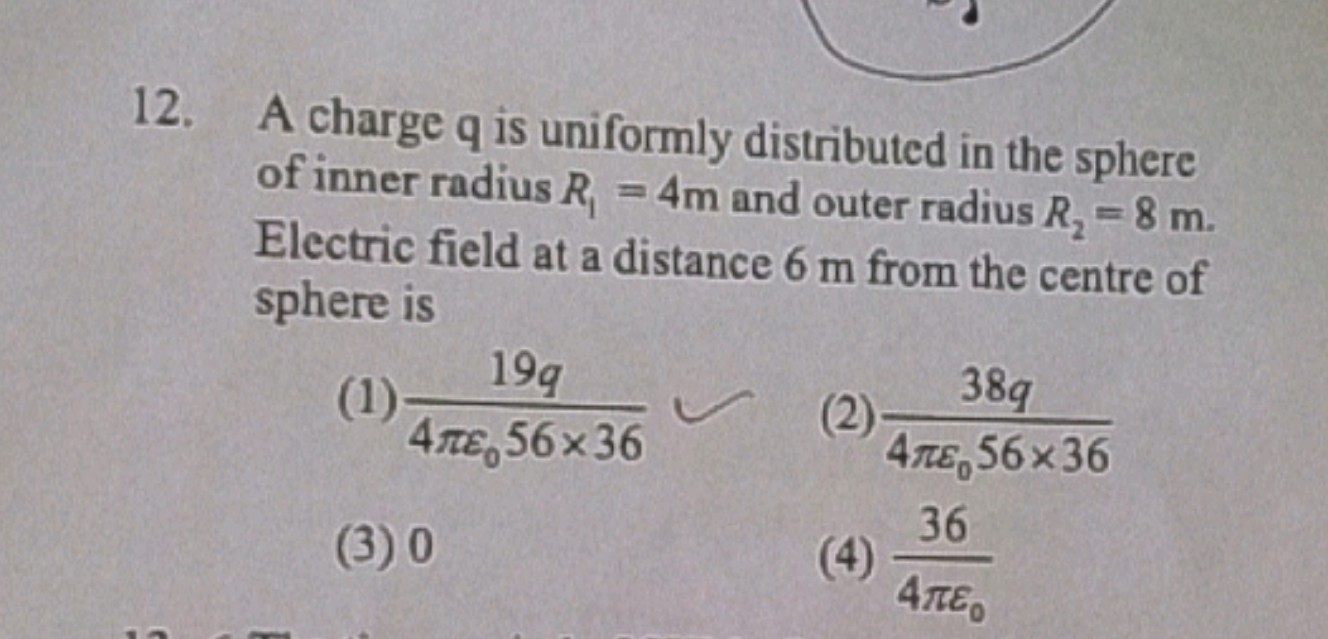 A charge q is uniformly distributed in the sphere of inner radius R1​=