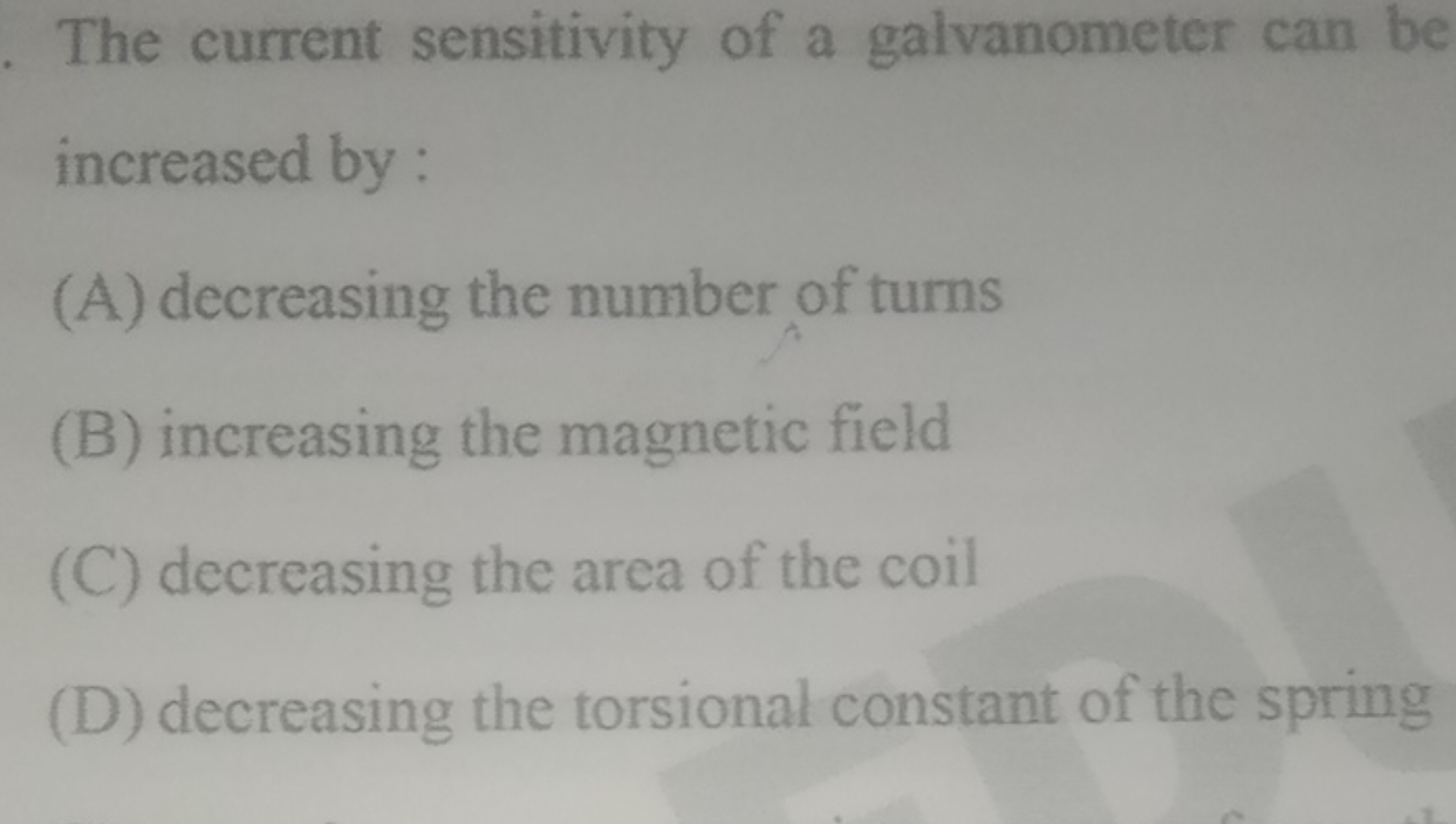 The current sensitivity of a galvanometer can be increased by :