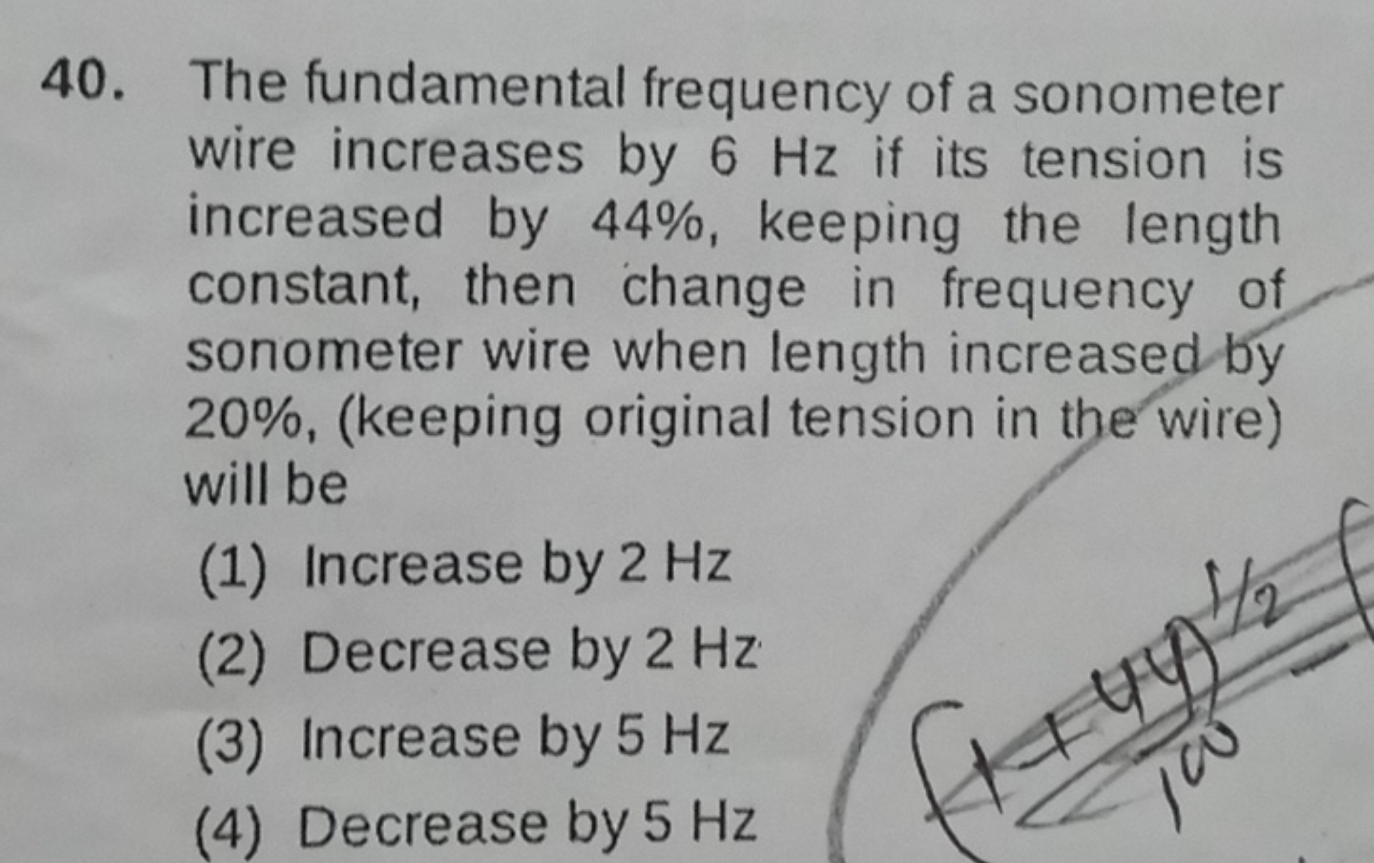 The fundamental frequency of a sonometer wire increases by 6 Hz if its