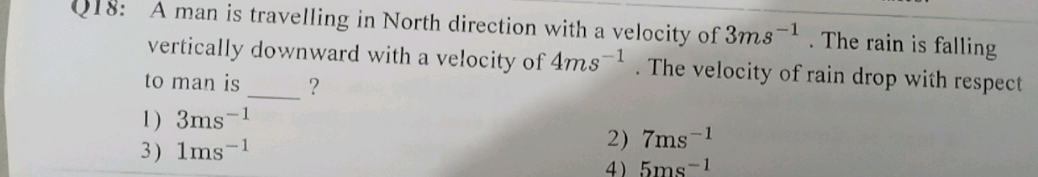 Q18: A man is travelling in North direction with a velocity of 3 ms−1.