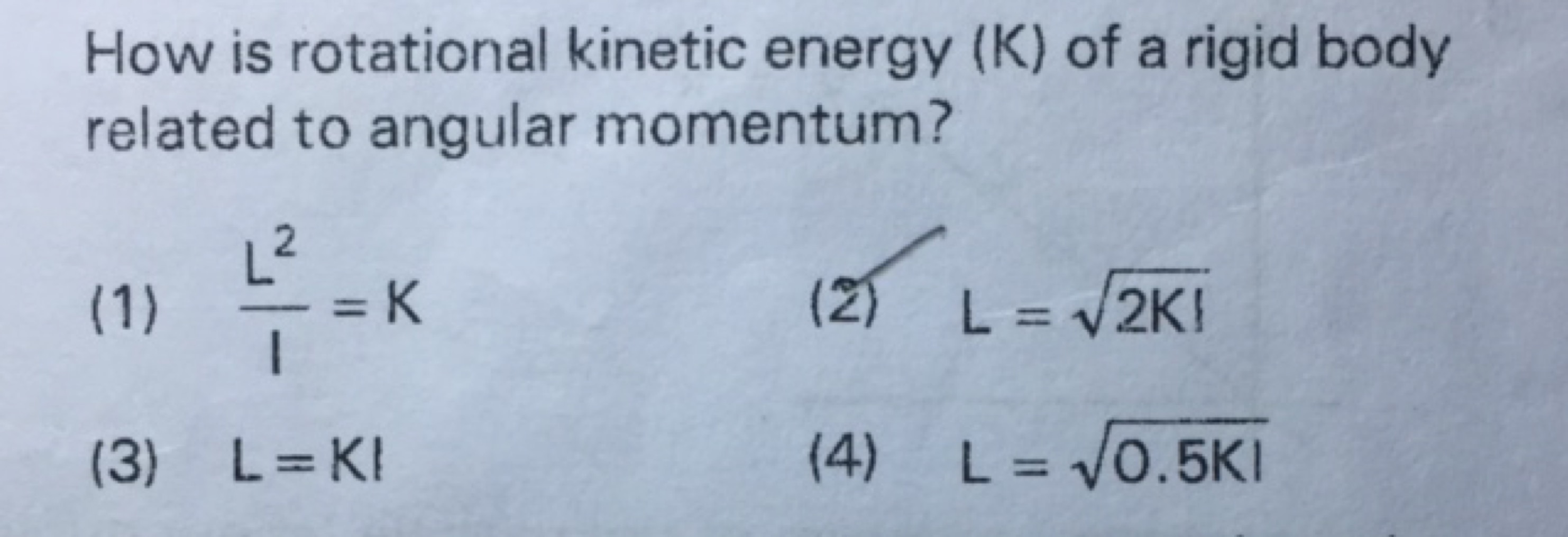 How is rotational kinetic energy (K) of a rigid body related to angula