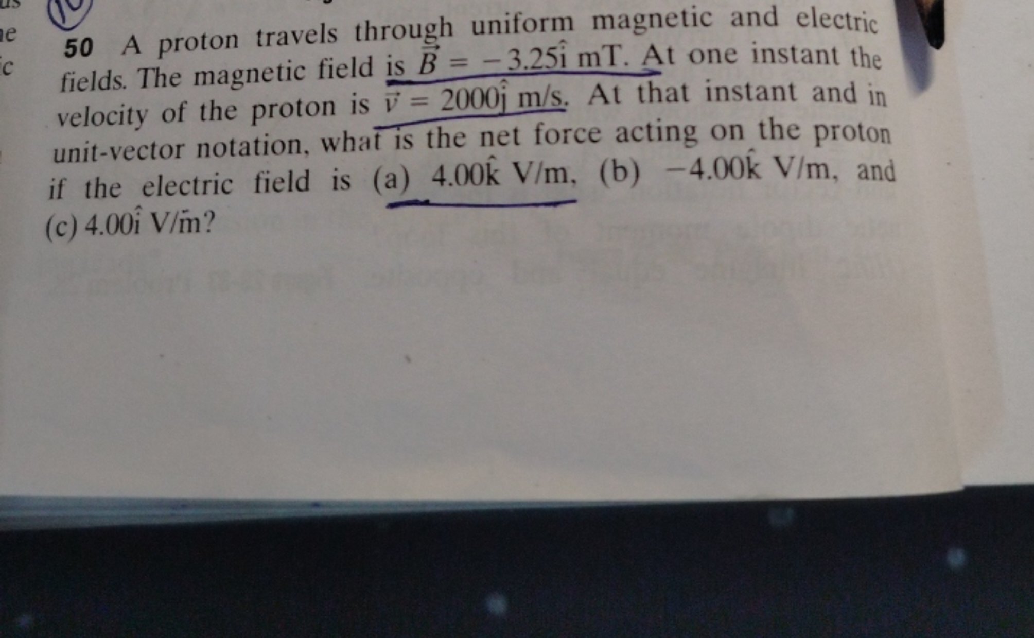 50 A proton travels through uniform magnetic and electric fields. The 