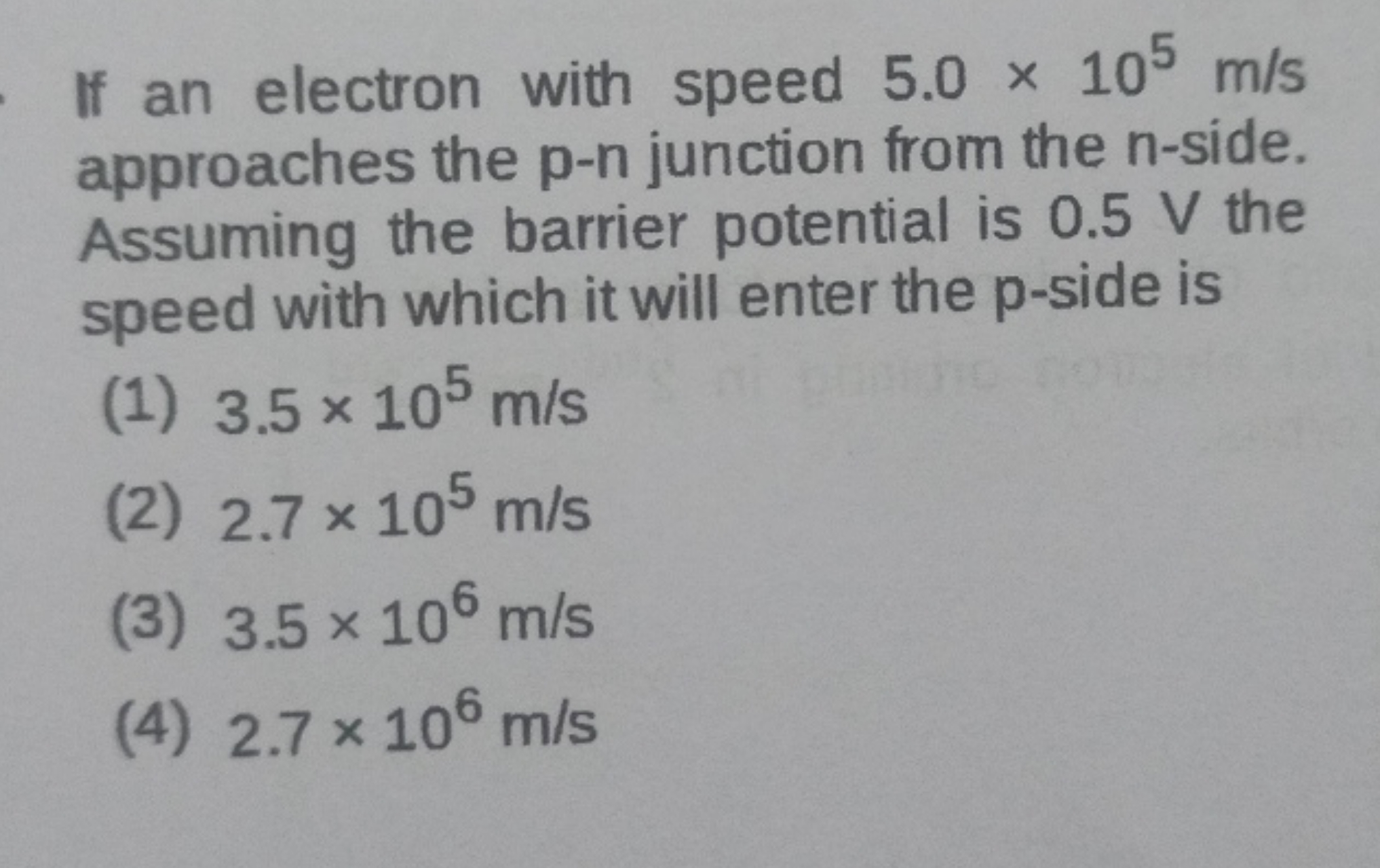 If an electron with speed 5.0×105 m/s approaches the p−n junction from