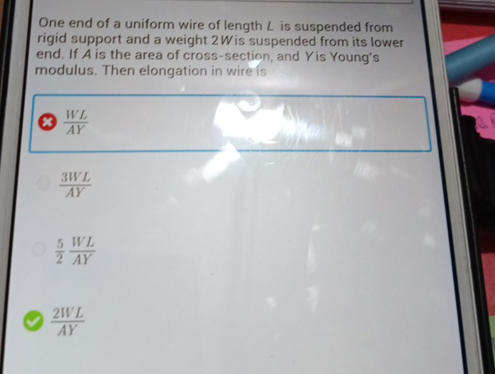 One end of a uniform wire of length L is suspended from rigid support 