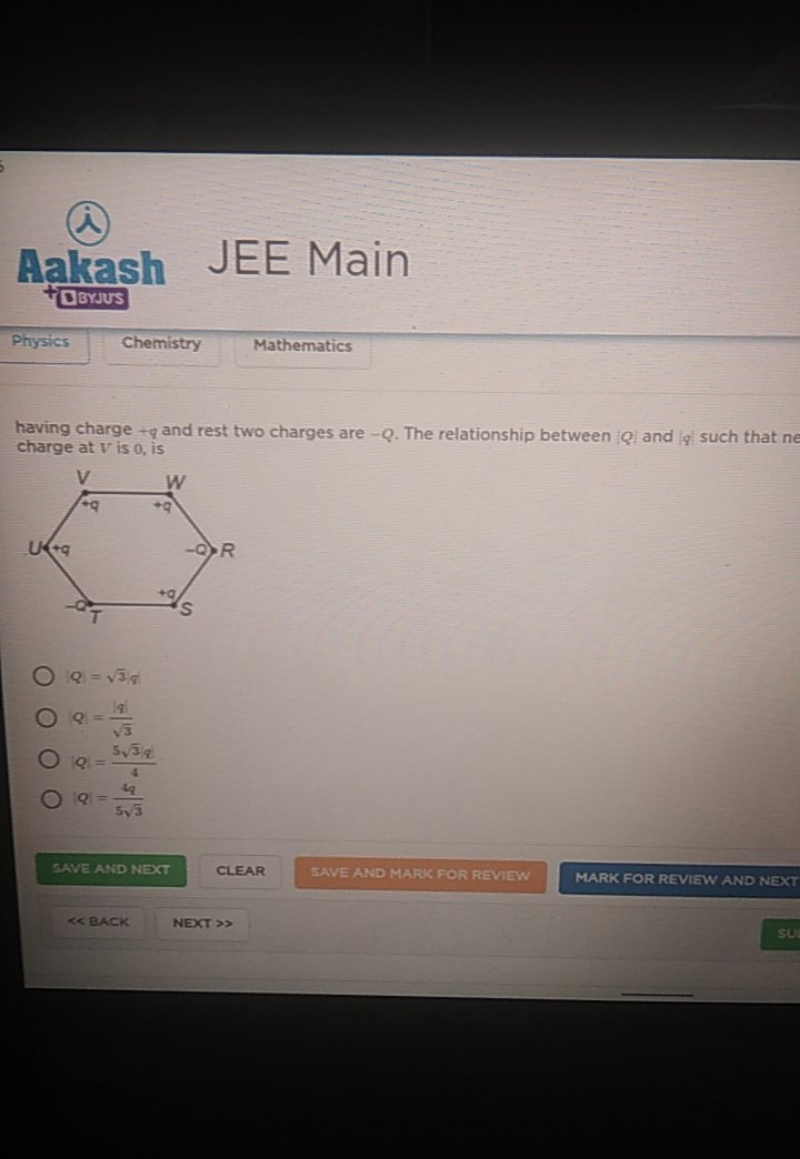 having charge +q and rest two charges are −Q. The relationship between