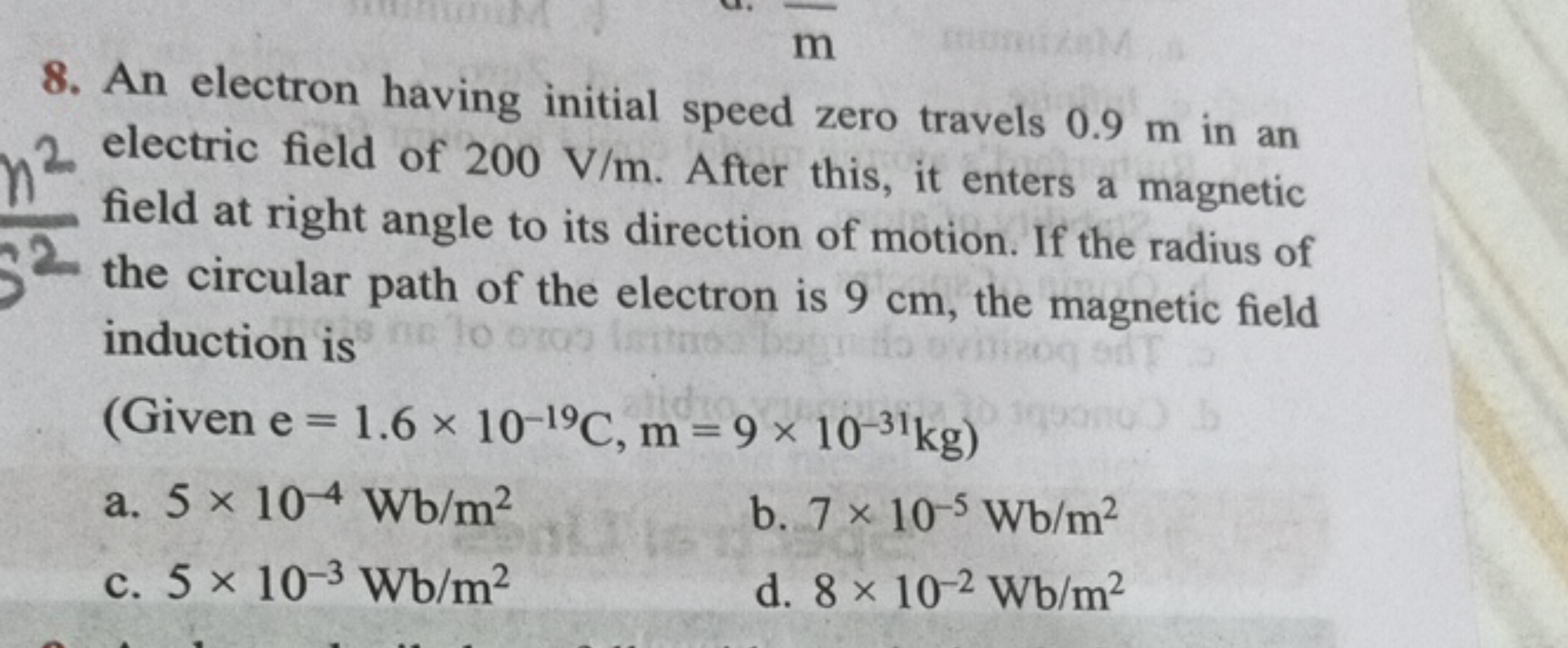 An electron having initial speed zero travels 0.9 m in an electric fie