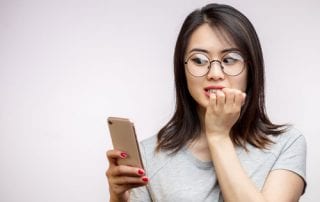 Selamatkan Keuangan Anda! OJK blokir 231 Fintech ilegal - 01 Shocked anxious surprised asian woman - UfaBizPhoto - shutterstock - 119138811 - Finansialku