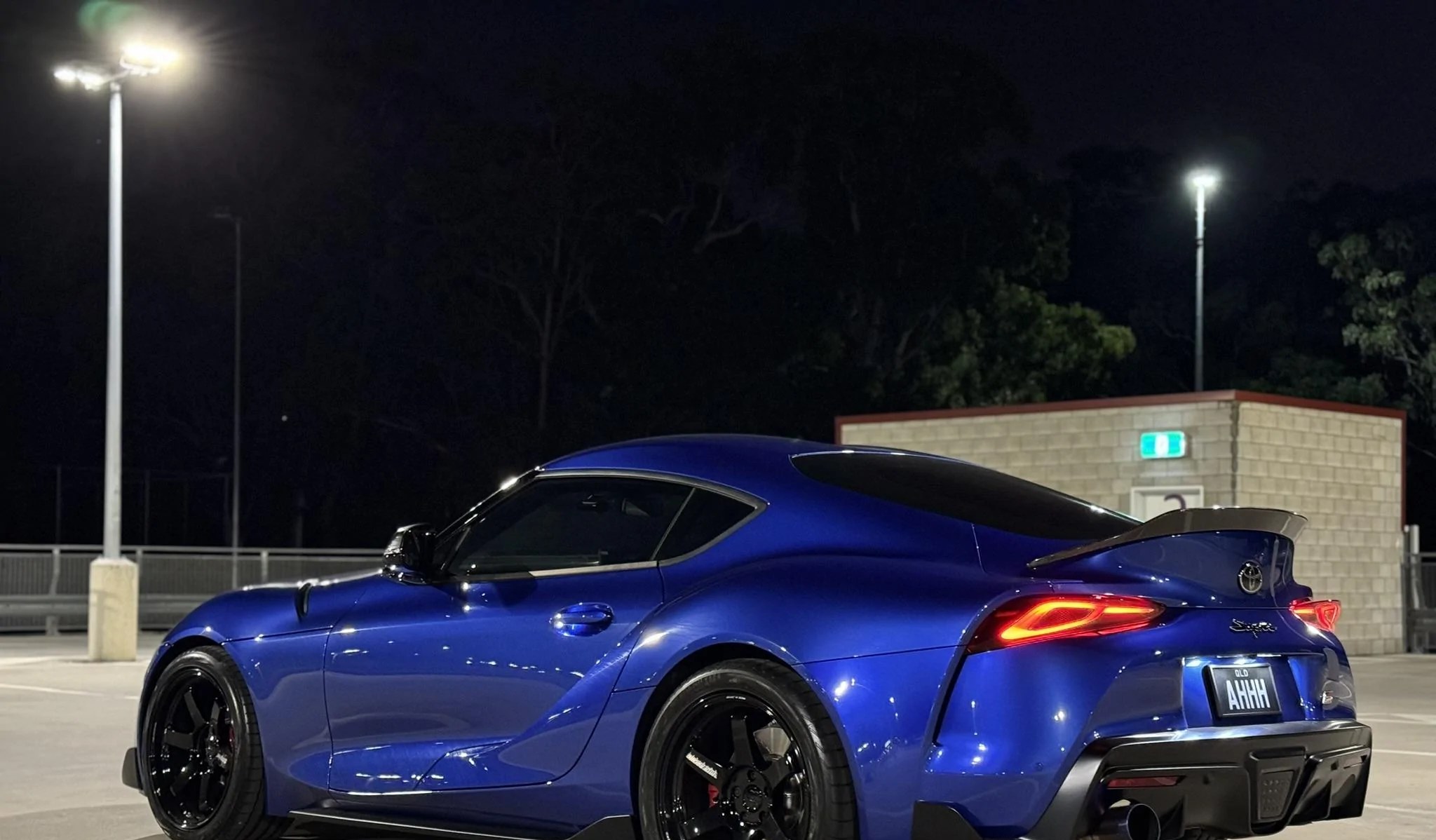 Blue Toyota GR Supra on Volk Racing TE37 Ultra wheels at night