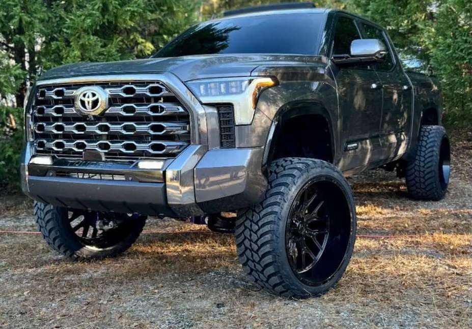 Lifted 2022 Toyota Tundra on 26x14 TIS 560B gloss black wheels