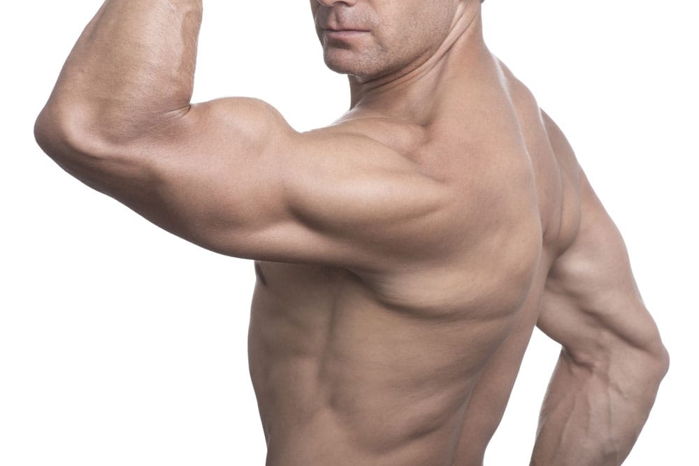 Man flexing bicep muscle