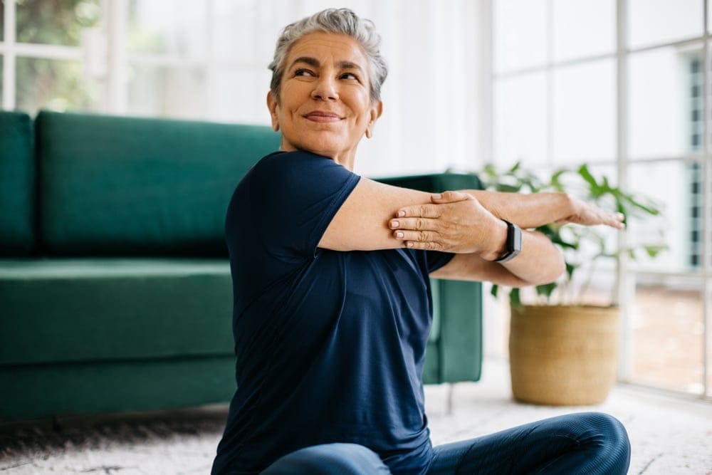 Woman stretching shoulders