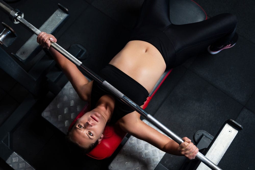 Woman bench pressing